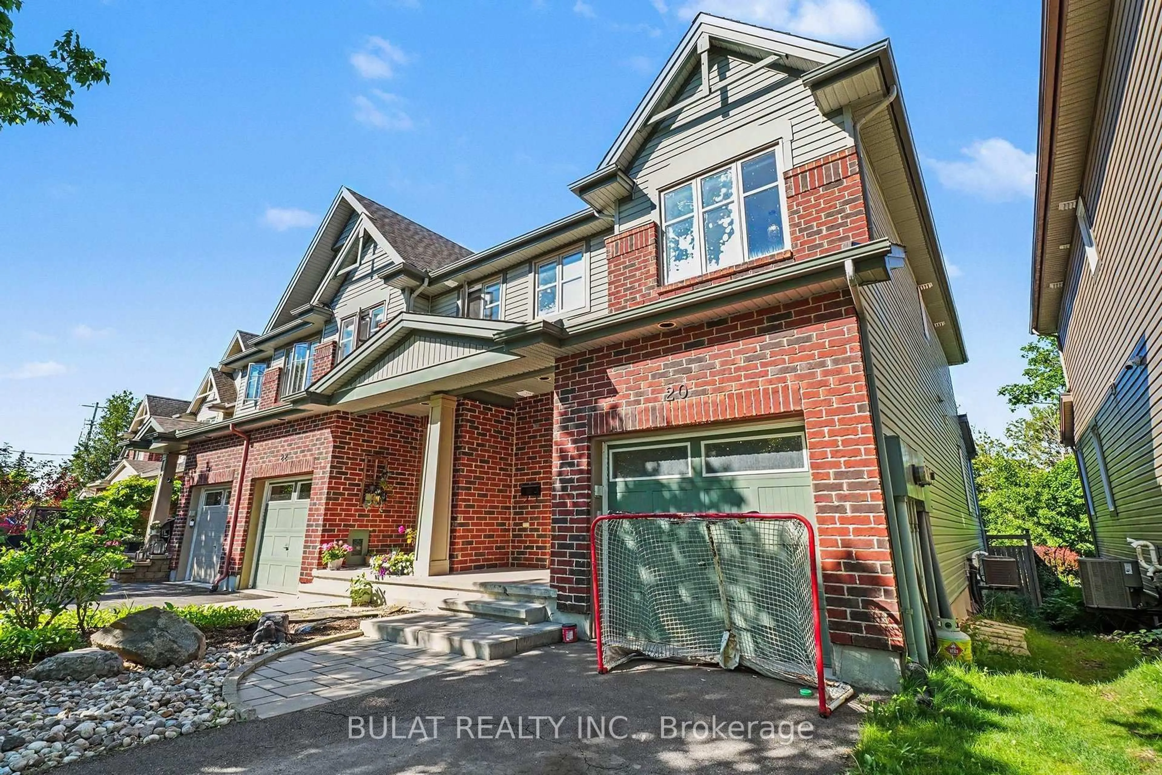 Home with brick exterior material, street for 20 Mccooeye Lane, Ottawa Ontario K2S 1B9