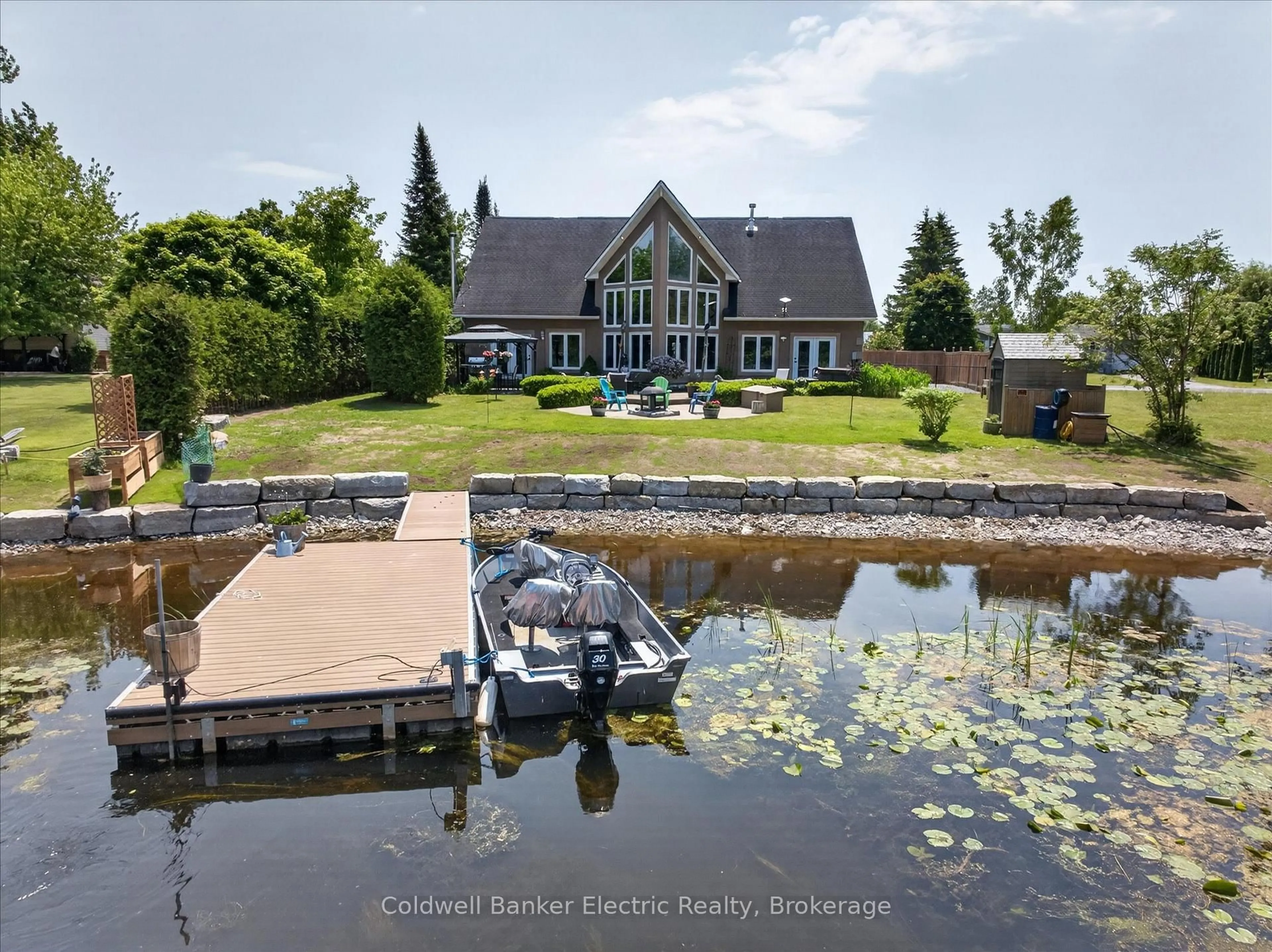 A pic from outside/outdoor area/front of a property/back of a property/a pic from drone, water/lake/river/ocean view for 1221 Youngs Cove Rd, Selwyn Ontario K0L 1T0