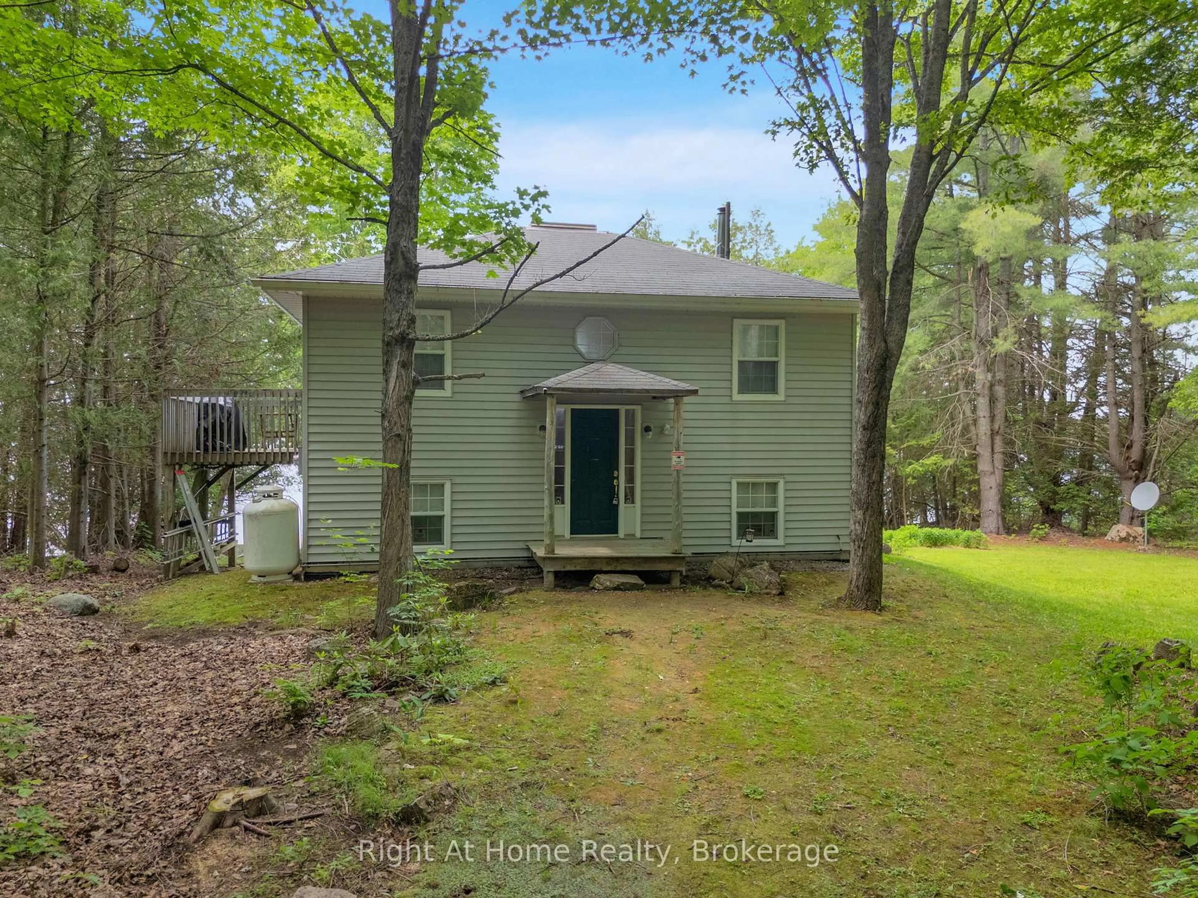 A pic from outside/outdoor area/front of a property/back of a property/a pic from drone, forest/trees view for 74 Talbot Rd, Kawartha Lakes Ontario K0M 1K0