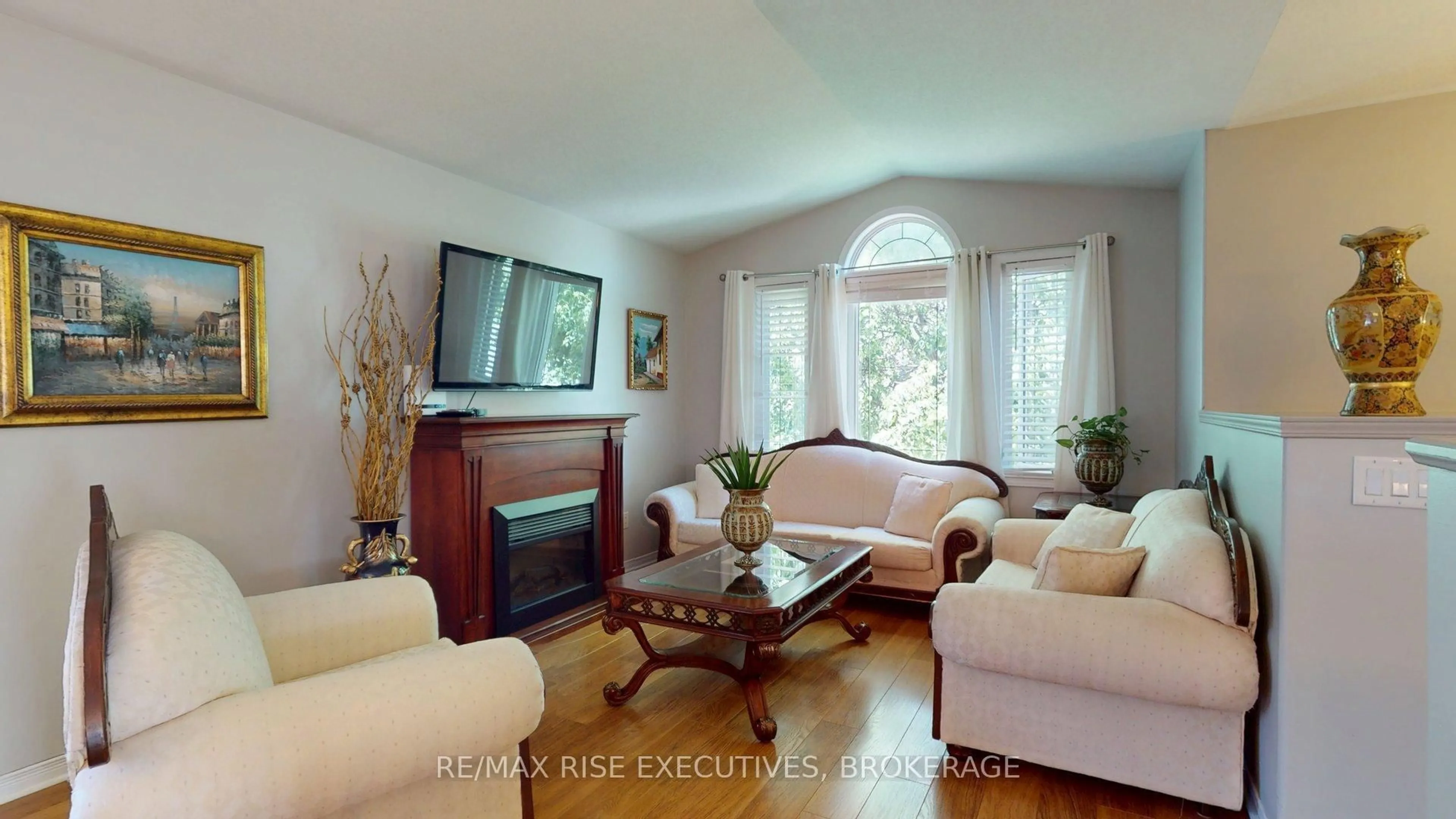 Living room with furniture, wood/laminate floor for 1452 Adams Ave, Kingston Ontario K7P 0B6