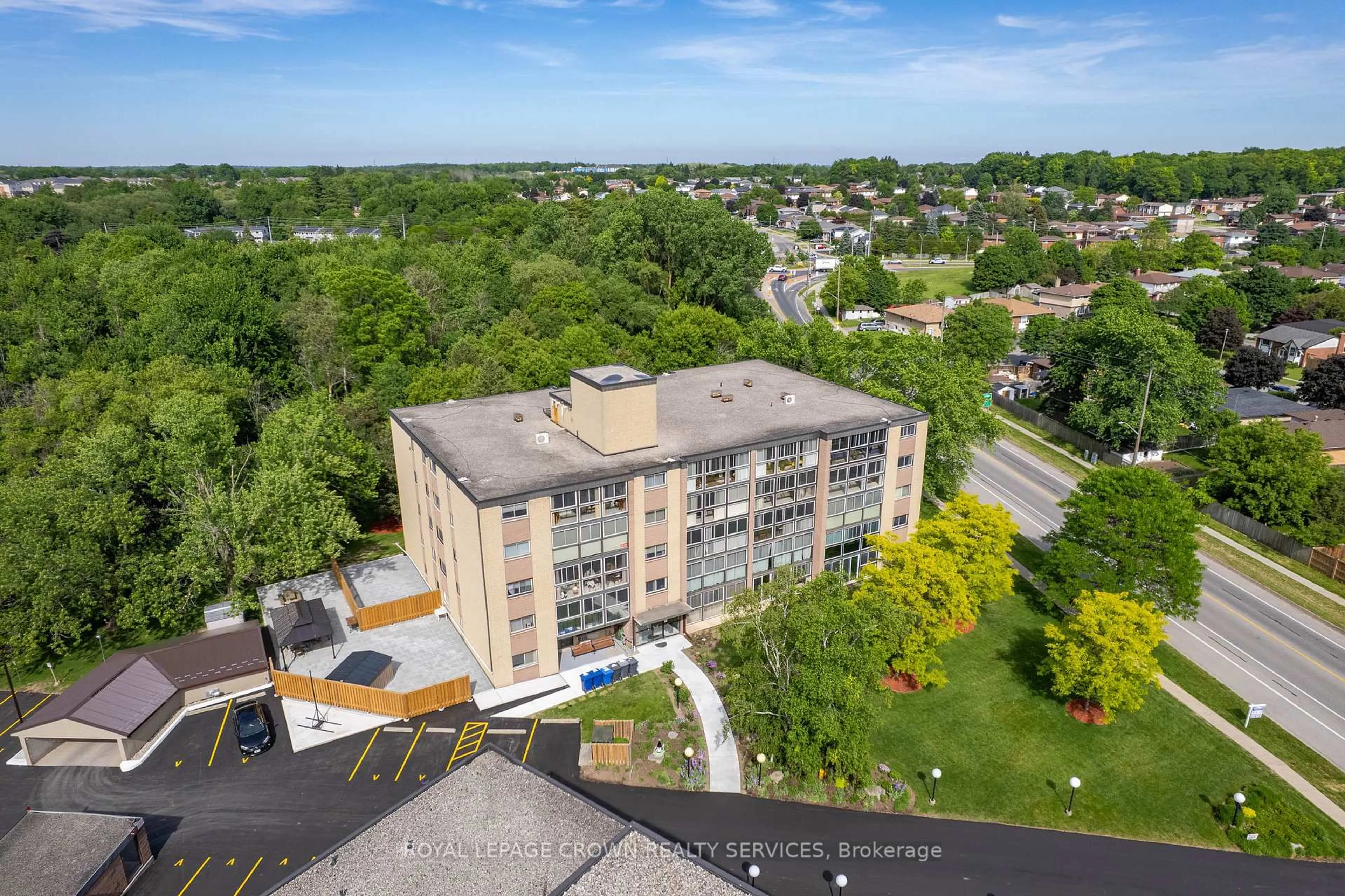A pic from outside/outdoor area/front of a property/back of a property/a pic from drone, city buildings view from balcony for 400 Champlain Blvd #105, Cambridge Ontario N1R 7J6