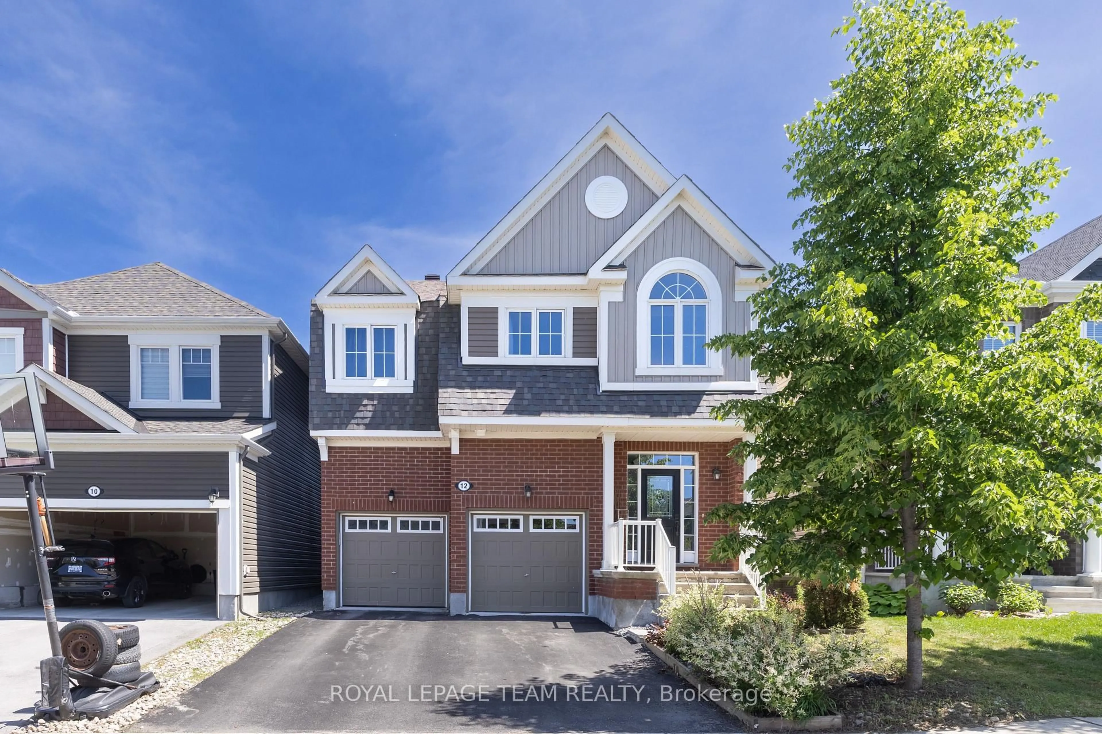 Home with brick exterior material, street for 12 Oxalis Cres, Ottawa Ontario K2V 0J8