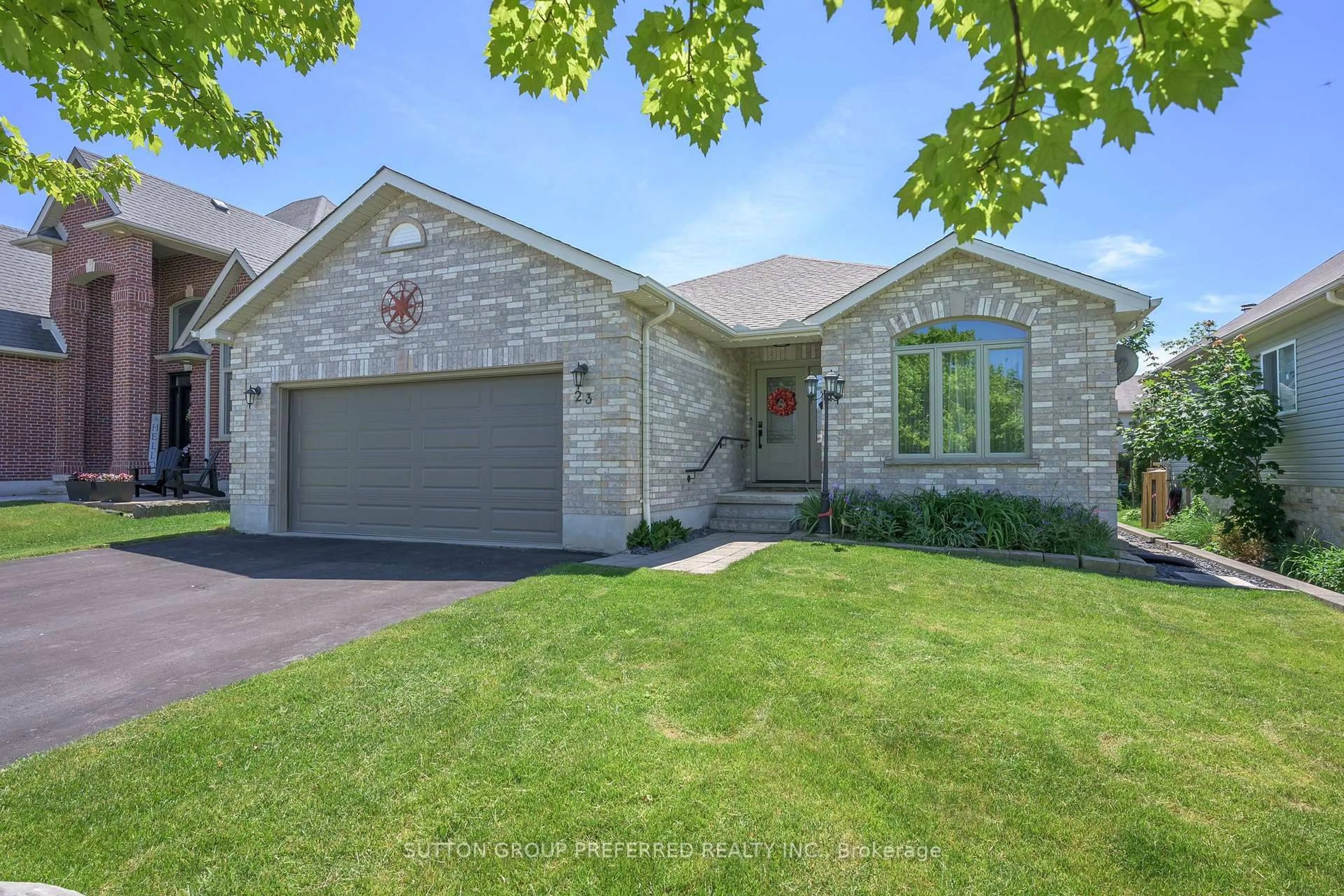 Home with brick exterior material, street for 23 Wood Lily Lane, Middlesex Centre Ontario N0M 2A0