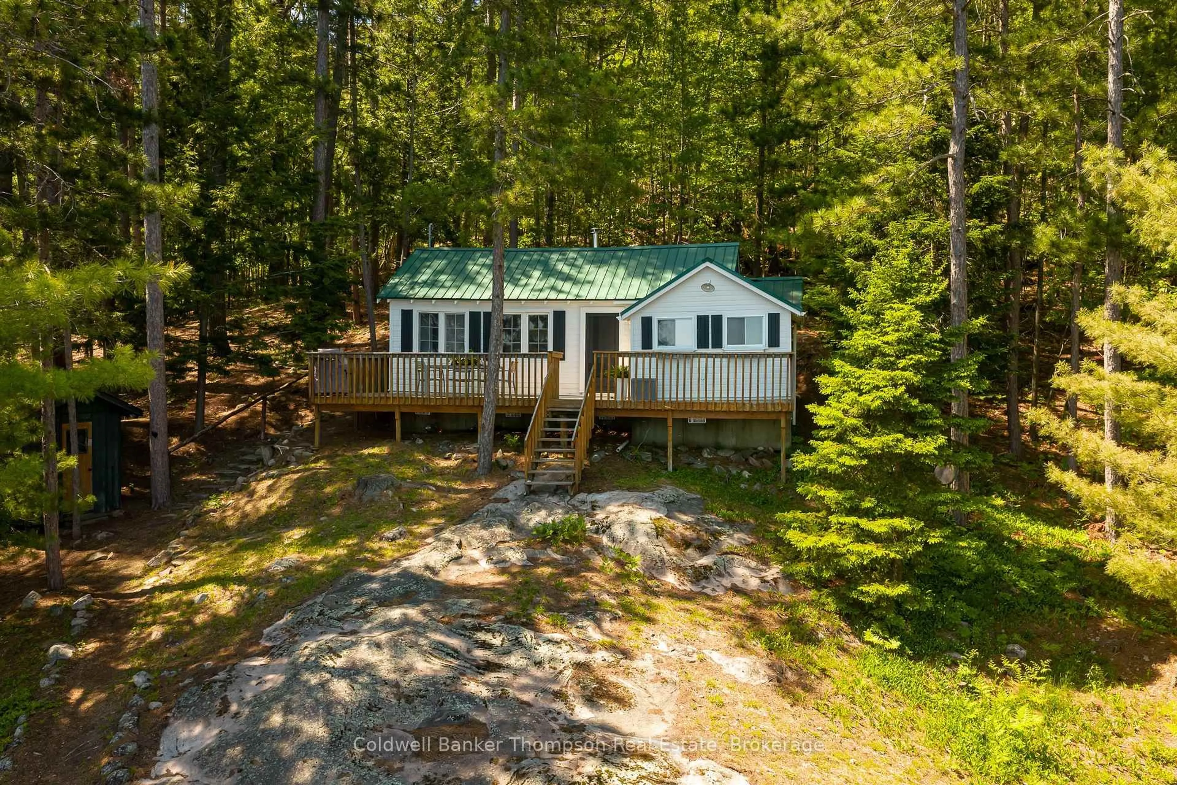 A pic from outside/outdoor area/front of a property/back of a property/a pic from drone, forest/trees view for 199 Gall Tr, Huntsville Ontario P0B 1M0