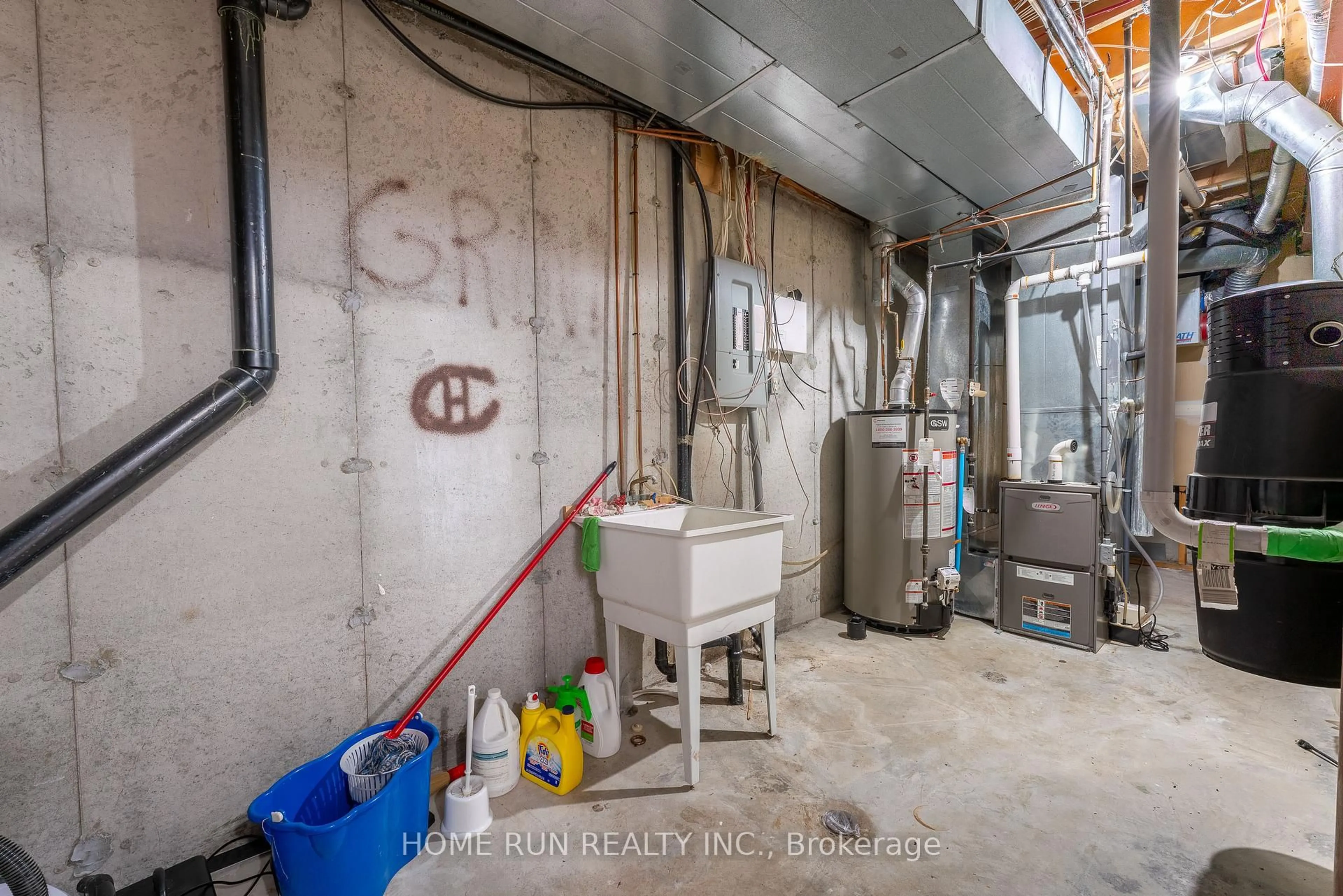 Kitchen with laundary machines, cement floor for 12 Gardengate Way, Ottawa Ontario K2G 5Z2