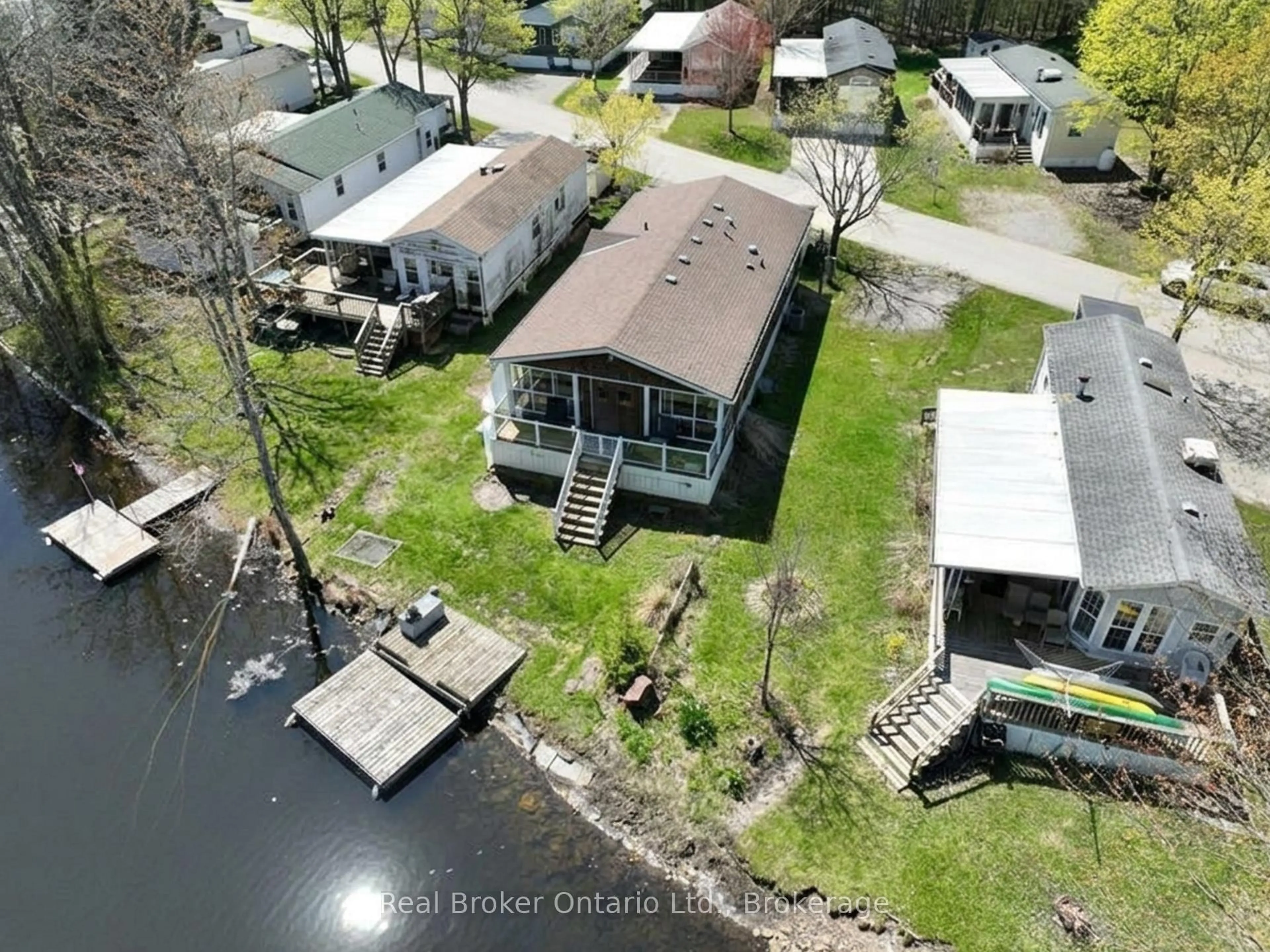 A pic from outside/outdoor area/front of a property/back of a property/a pic from drone, water/lake/river/ocean view for 13 Southline Ave #M24, Huron-Kinloss Ontario N2Z 2X5