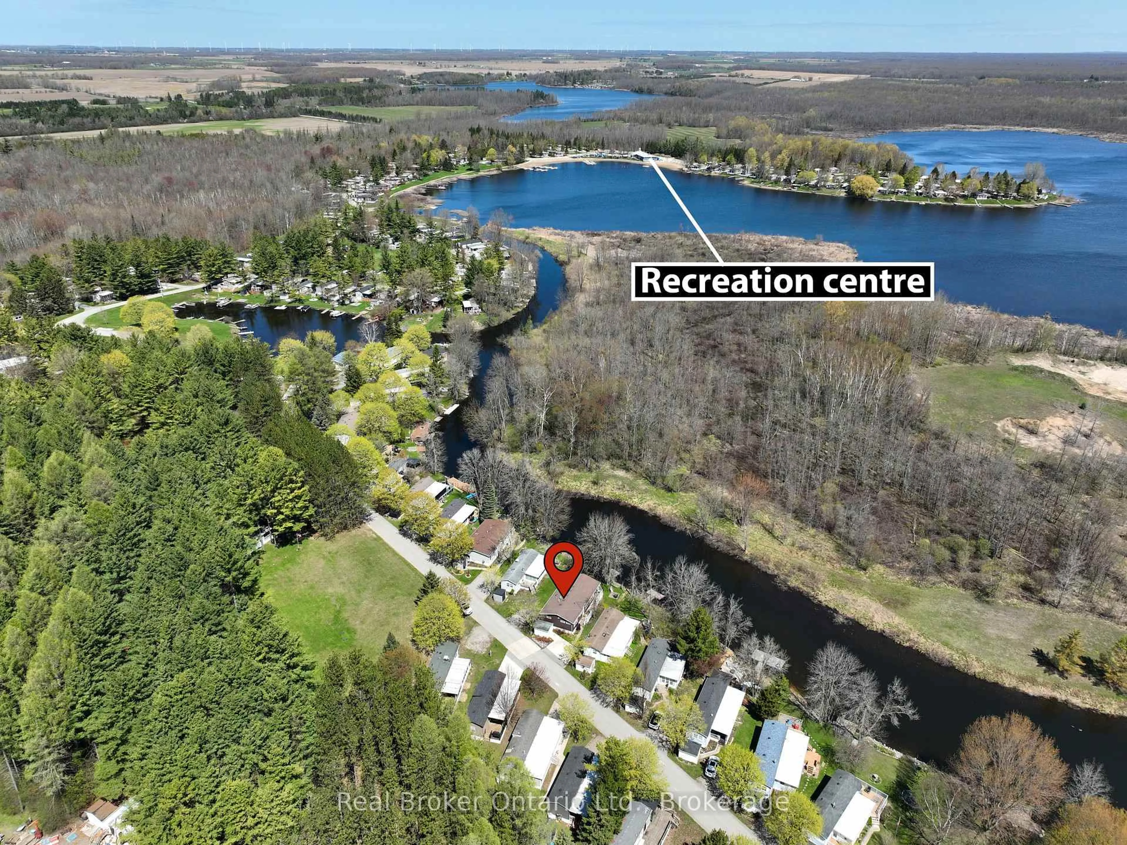 A pic from outside/outdoor area/front of a property/back of a property/a pic from drone, water/lake/river/ocean view for 13 Southline Ave #M24, Huron-Kinloss Ontario N2Z 2X5