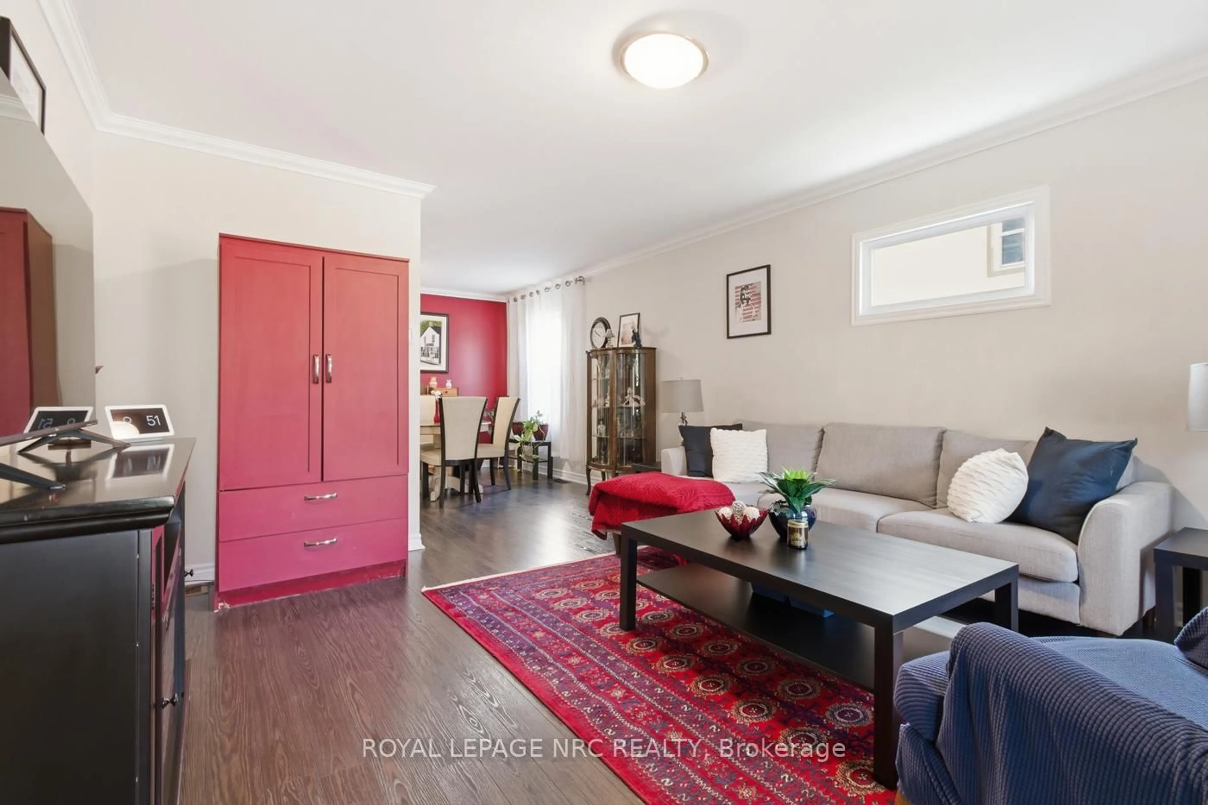 Living room with furniture, wood/laminate floor for 255 Deere St, Welland Ontario L3B 2L9