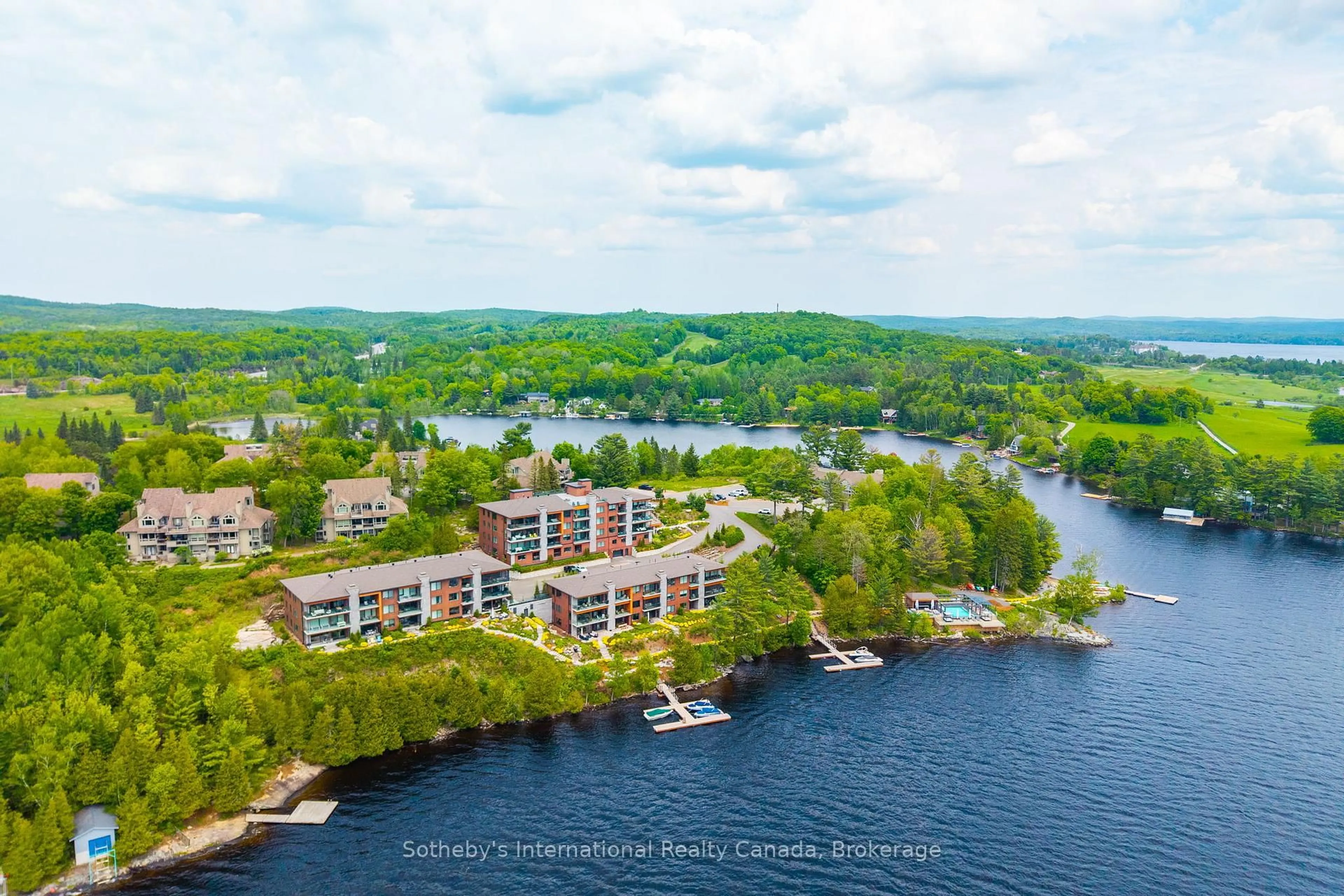 A pic from outside/outdoor area/front of a property/back of a property/a pic from drone, water/lake/river/ocean view for 727 Grandview Dr #210, Huntsville Ontario P1H 2J5
