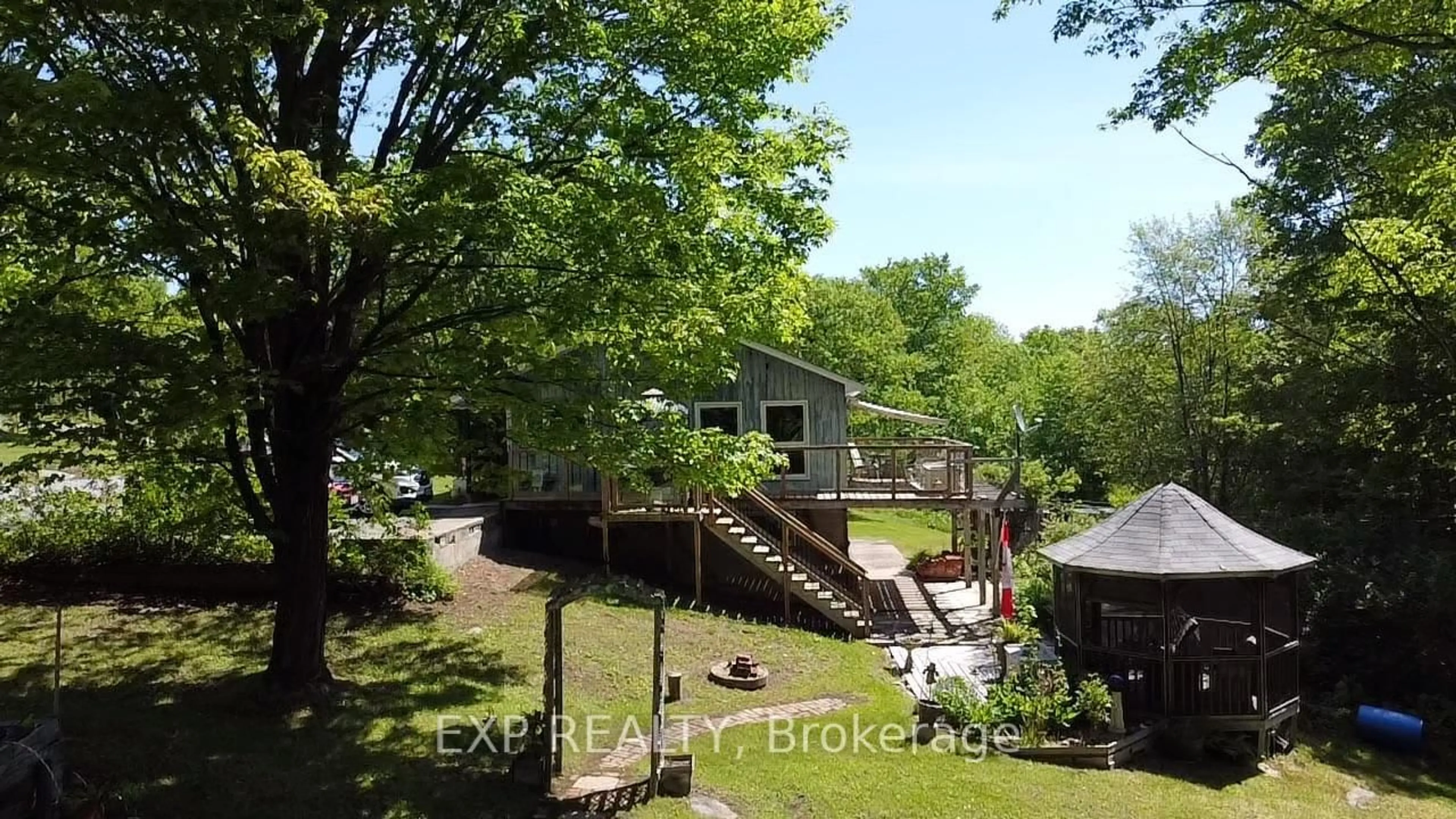 A pic from outside/outdoor area/front of a property/back of a property/a pic from drone, water/lake/river/ocean view for 499 Centreview Rd, Combermere Ontario K0J 1L0