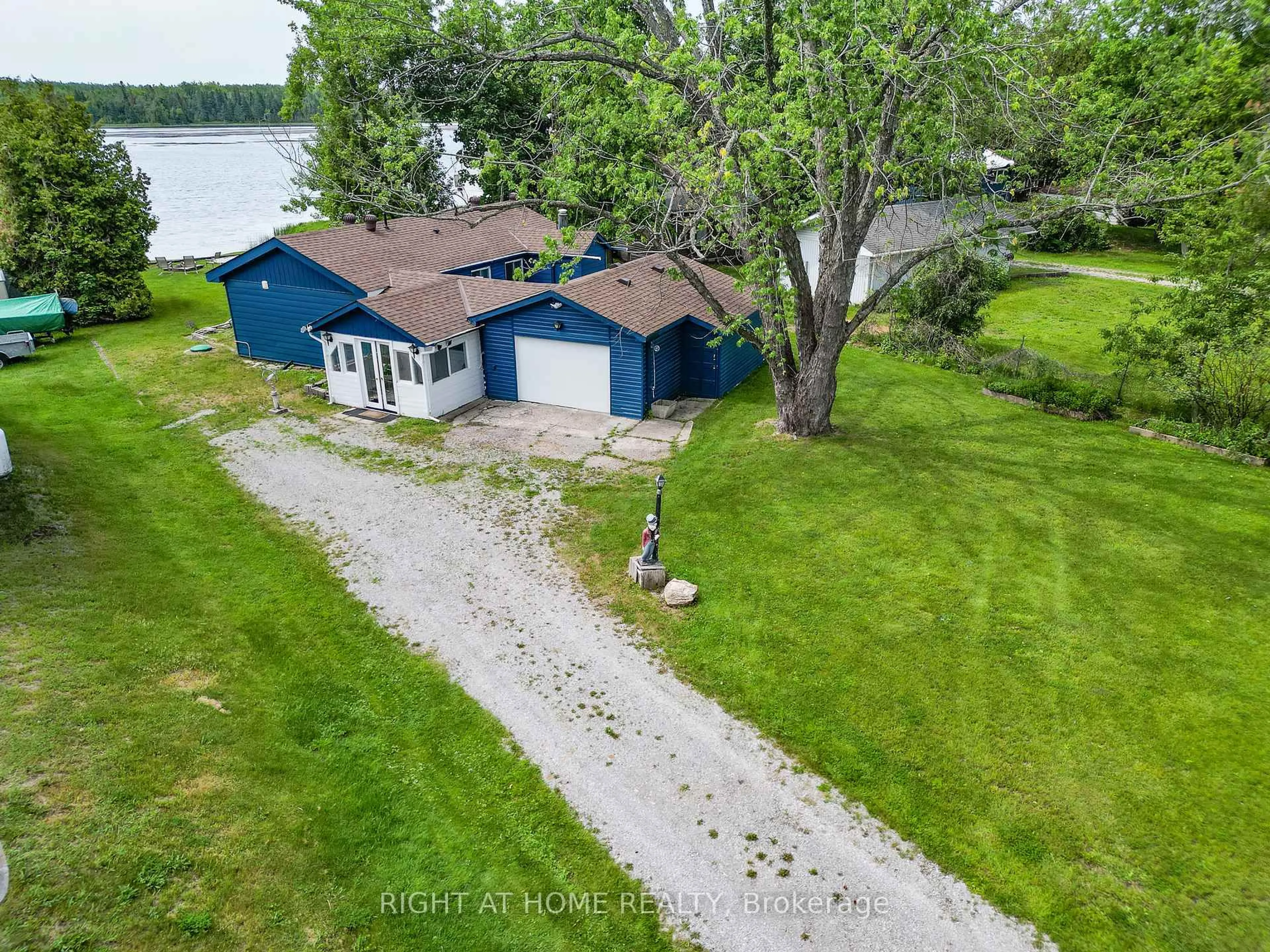 A pic from outside/outdoor area/front of a property/back of a property/a pic from drone, water/lake/river/ocean view for 203 Mcguire Beach Rd, Kawartha Lakes Ontario K0M 2B0