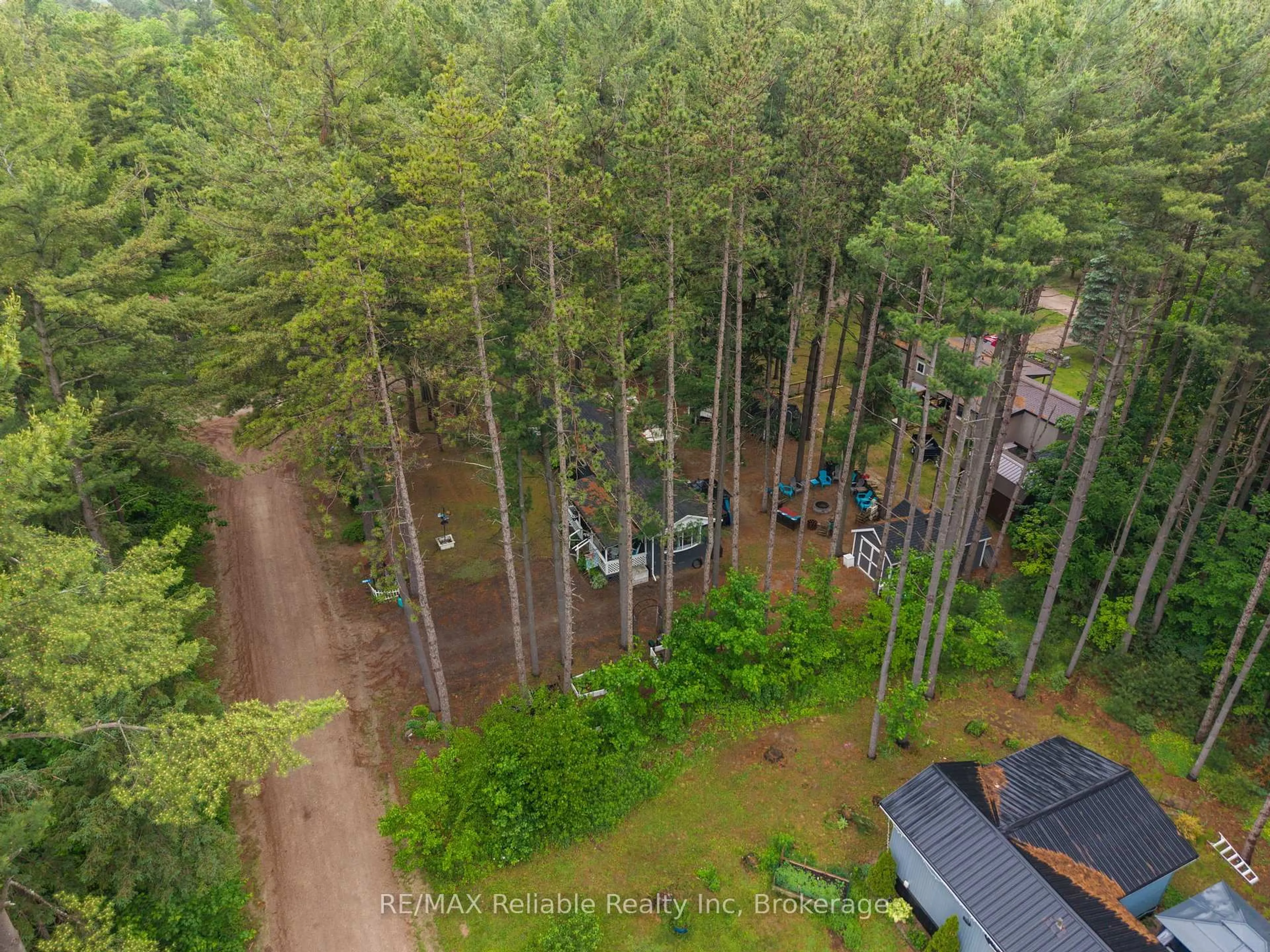 A pic from outside/outdoor area/front of a property/back of a property/a pic from drone, forest/trees view for 401 Sugar Maple Dr, Central Huron Ontario N0M 1G0