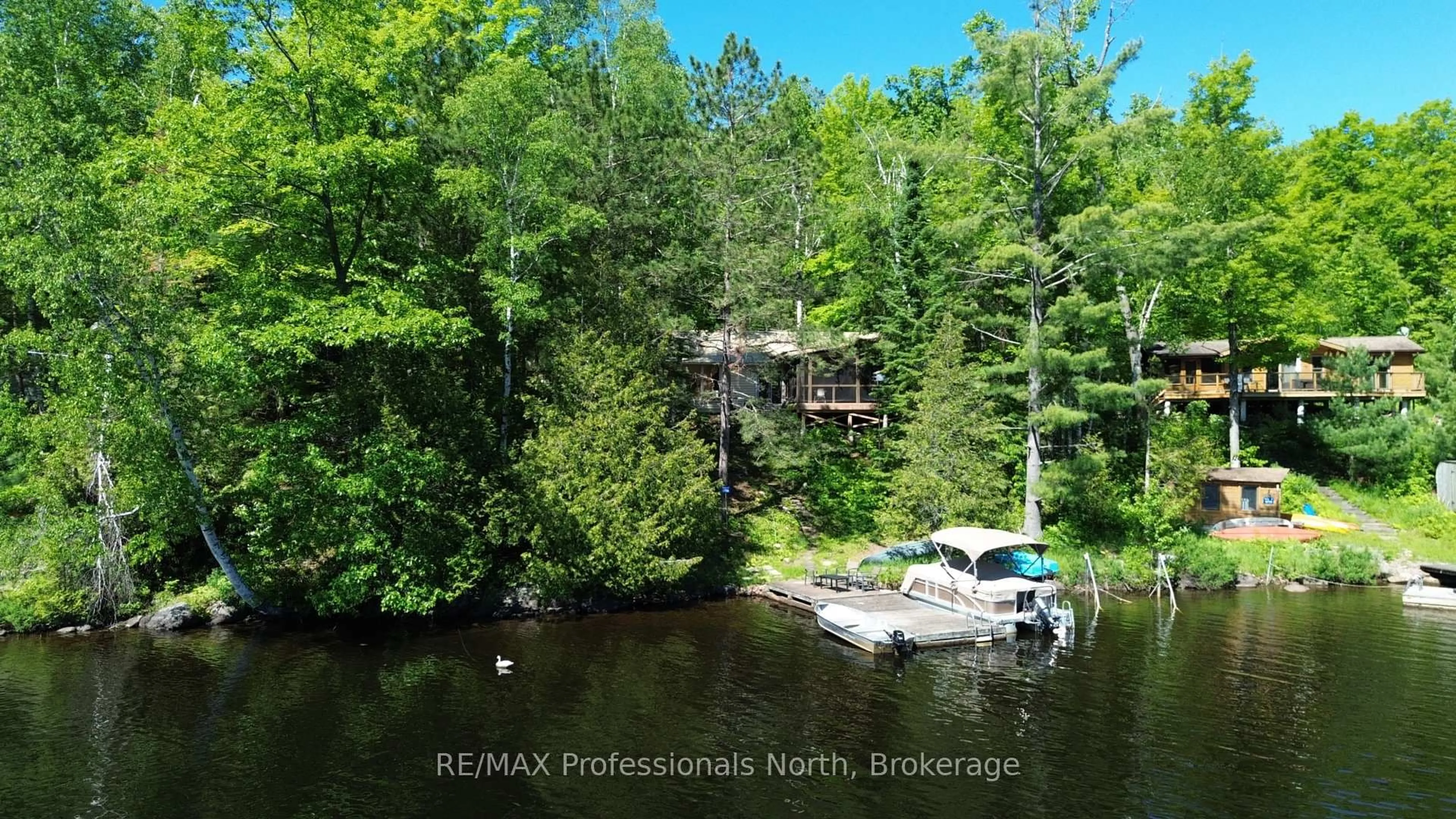 A pic from outside/outdoor area/front of a property/back of a property/a pic from drone, water/lake/river/ocean view for 10729 Black Lake WAO, Minden Hills Ontario K0M 2L1