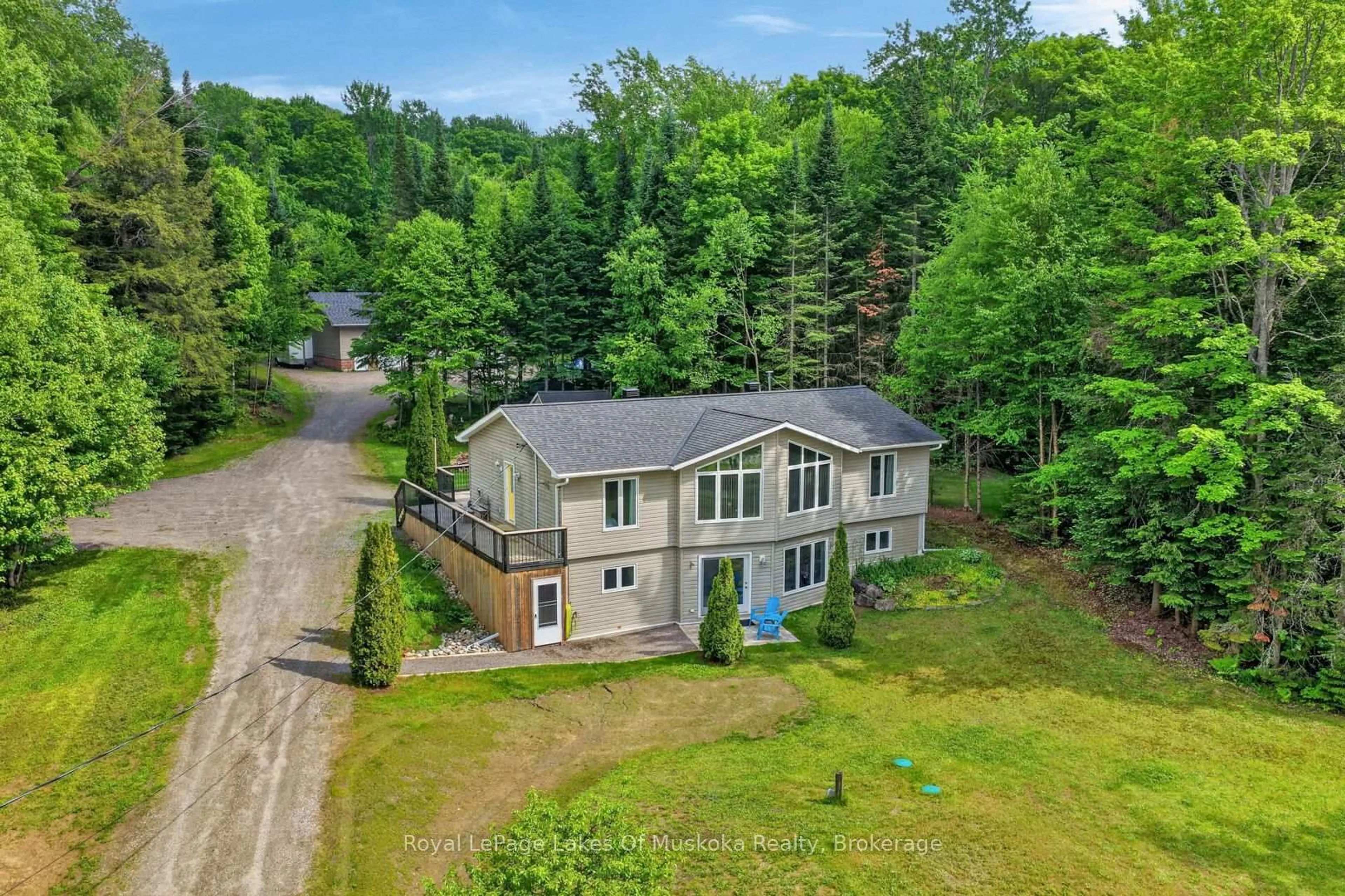 A pic from outside/outdoor area/front of a property/back of a property/a pic from drone, water/lake/river/ocean view for 1957 Lone Pine Dr, Huntsville Ontario P0B 1L0