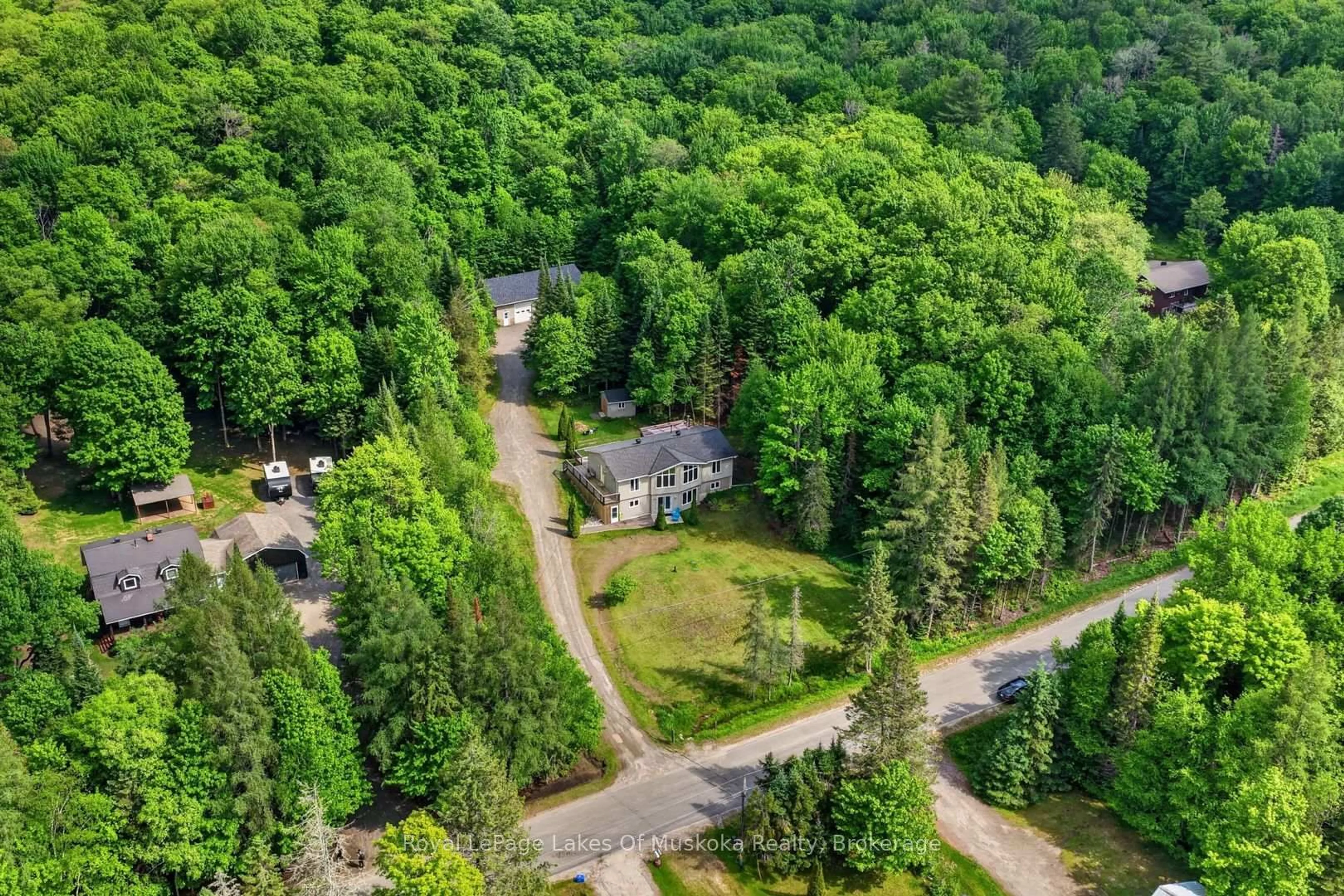 A pic from outside/outdoor area/front of a property/back of a property/a pic from drone, forest/trees view for 1957 Lone Pine Dr, Huntsville Ontario P0B 1L0