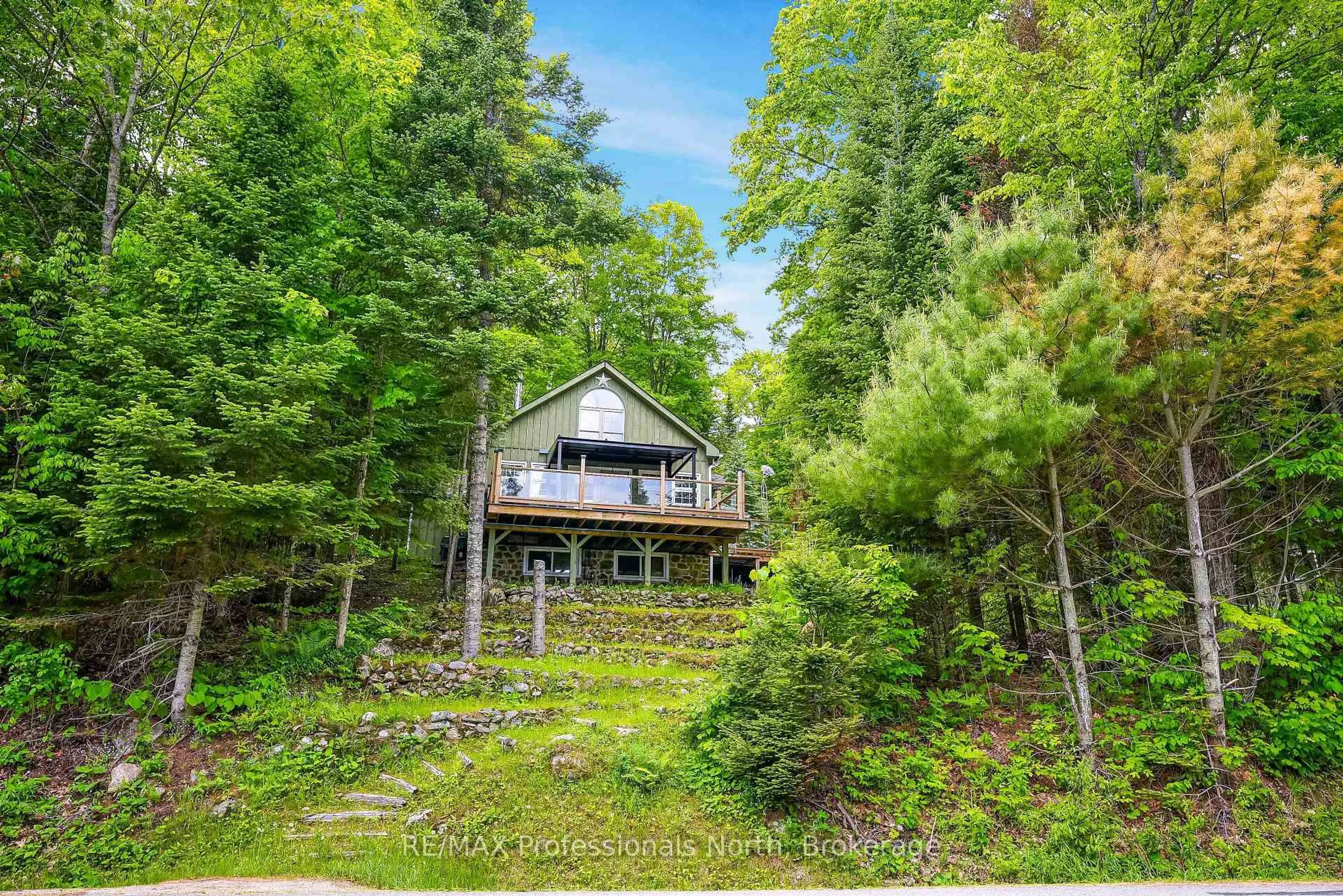 A pic from outside/outdoor area/front of a property/back of a property/a pic from drone, water/lake/river/ocean view for 1214 Kashagawigamog Lake Rd, Minden Hills Ontario K0M 2K0