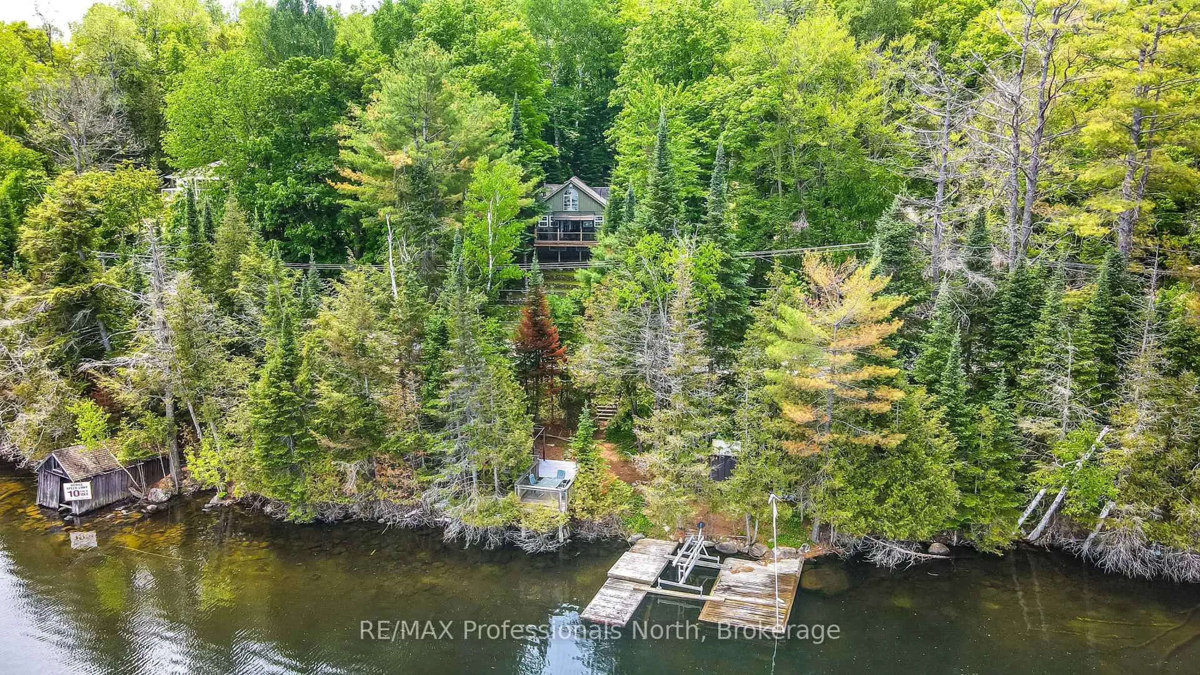 A pic from outside/outdoor area/front of a property/back of a property/a pic from drone, water/lake/river/ocean view for 1214 Kashagawigamog Lake Rd, Minden Hills Ontario K0M 2K0