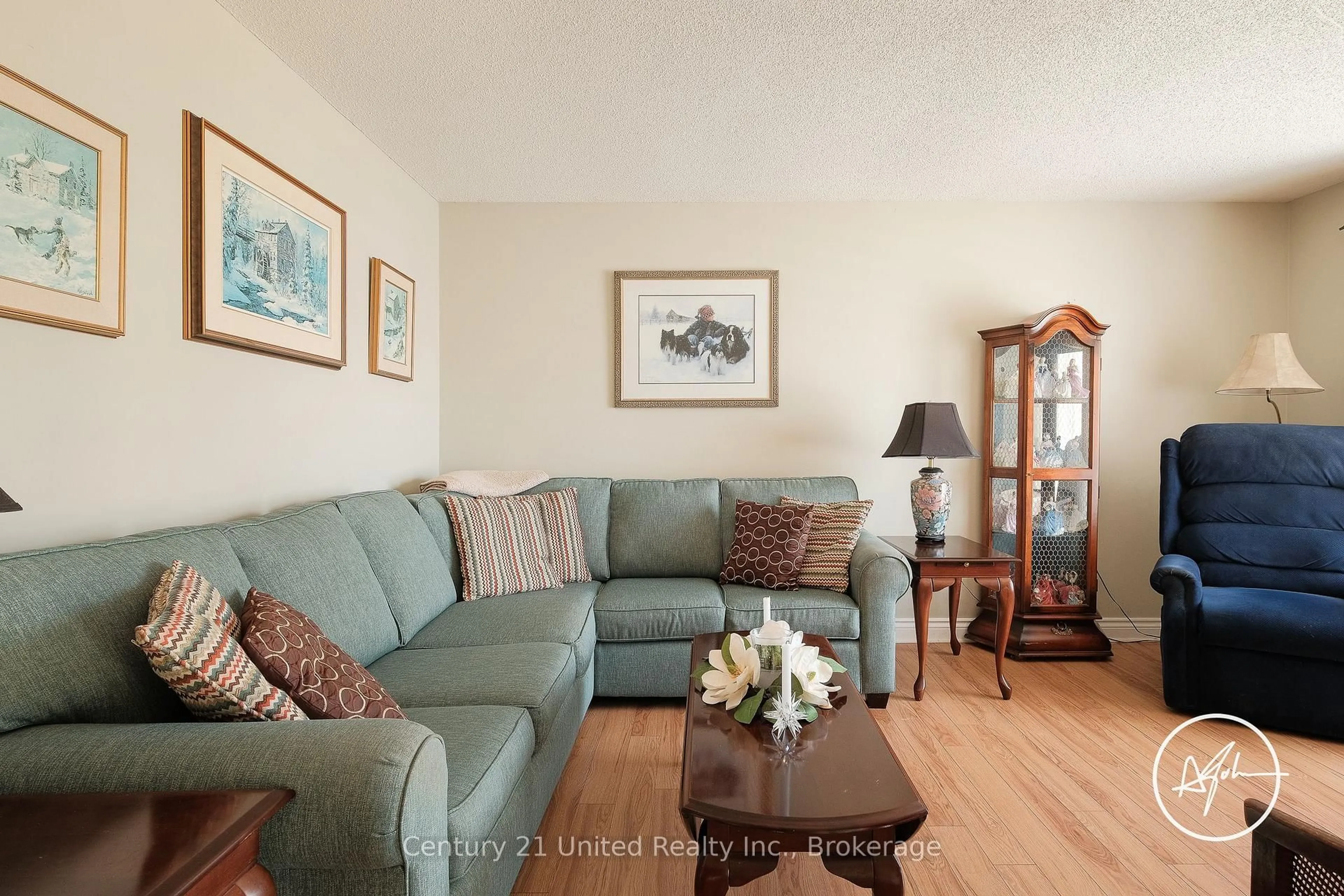 Living room with furniture, wood/laminate floor for 2606 Foxmeadow Rd, Peterborough Ontario K9L 1X3