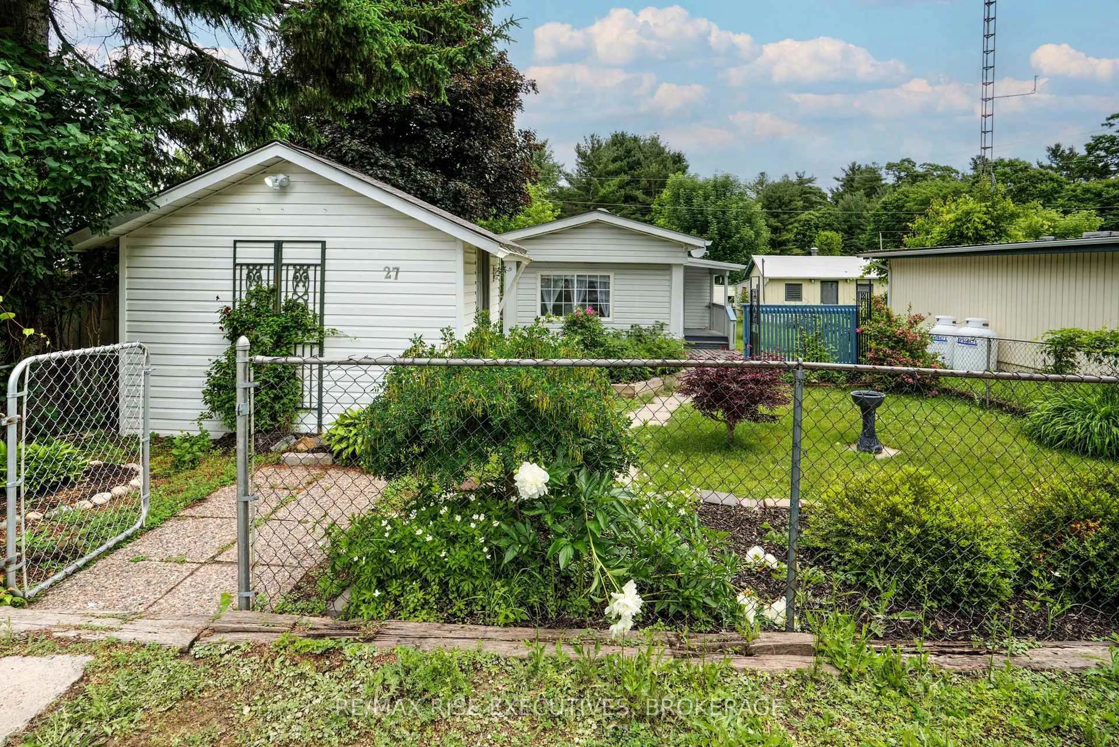 Home with vinyl exterior material, street for 104 Ellisville Rd #27, Leeds and the Thousand Islands Ontario K0H 2N0