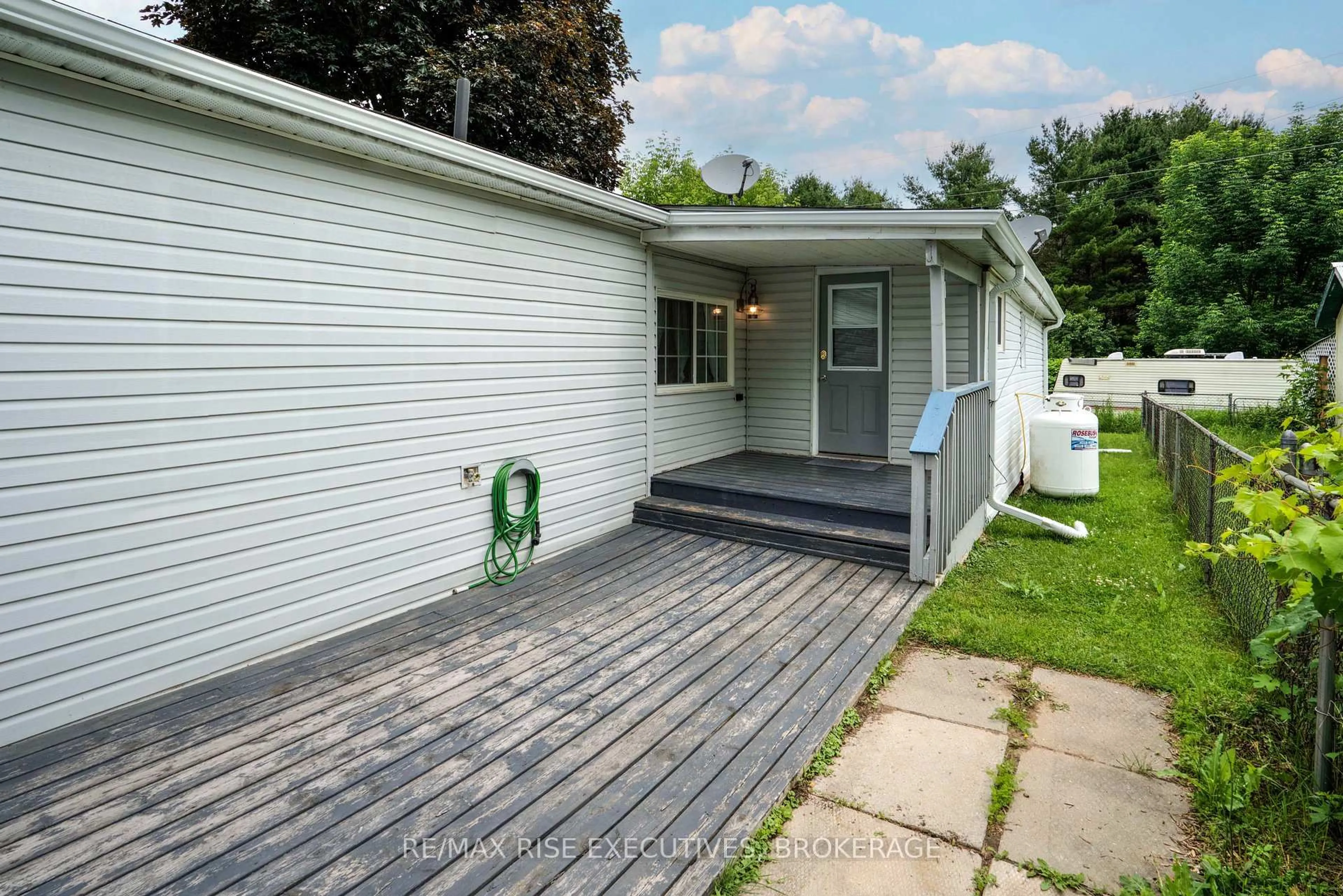 Home with vinyl exterior material, street for 104 Ellisville Rd #27, Leeds and the Thousand Islands Ontario K0H 2N0