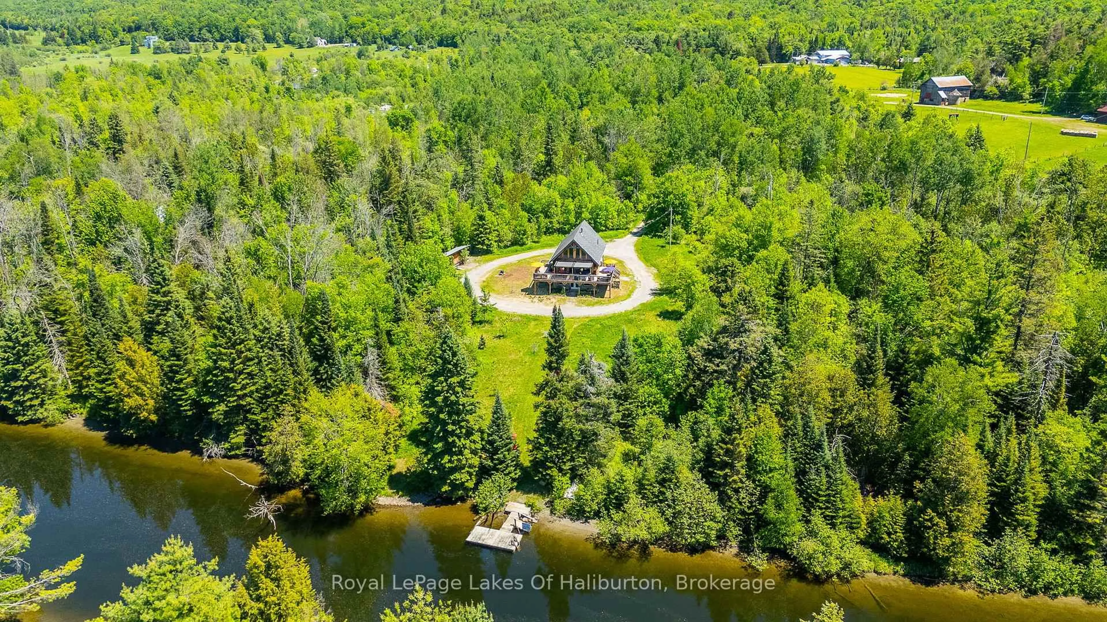 A pic from outside/outdoor area/front of a property/back of a property/a pic from drone, water/lake/river/ocean view for 1393 Hunter Creek Rd, Minden Hills Ontario K0M 2K0