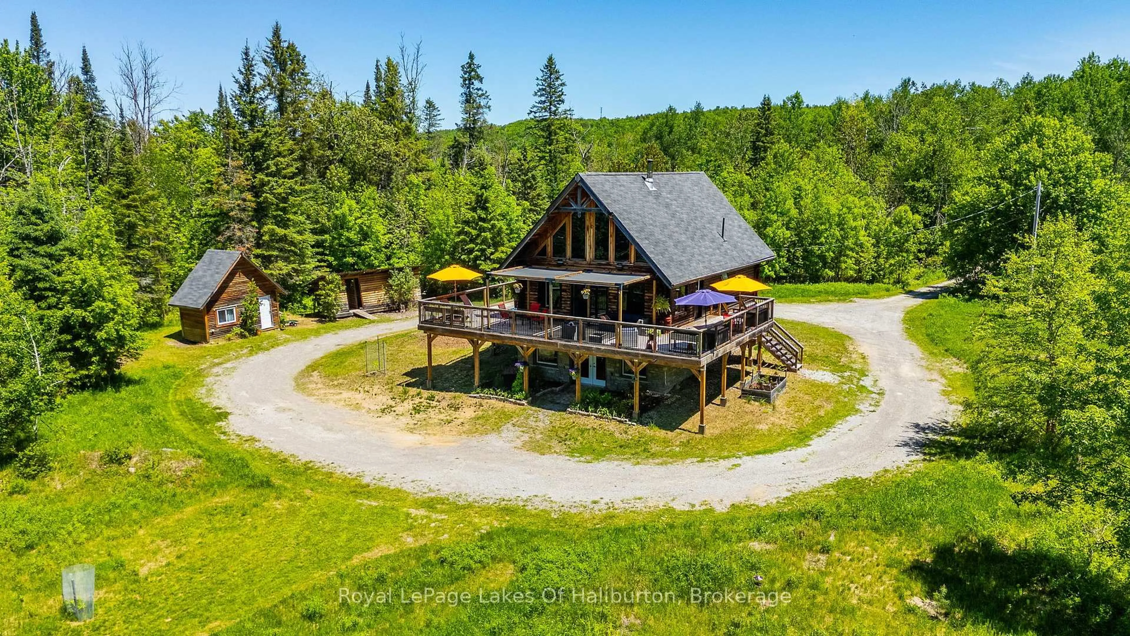 A pic from outside/outdoor area/front of a property/back of a property/a pic from drone, mountain view for 1393 Hunter Creek Rd, Minden Hills Ontario K0M 2K0