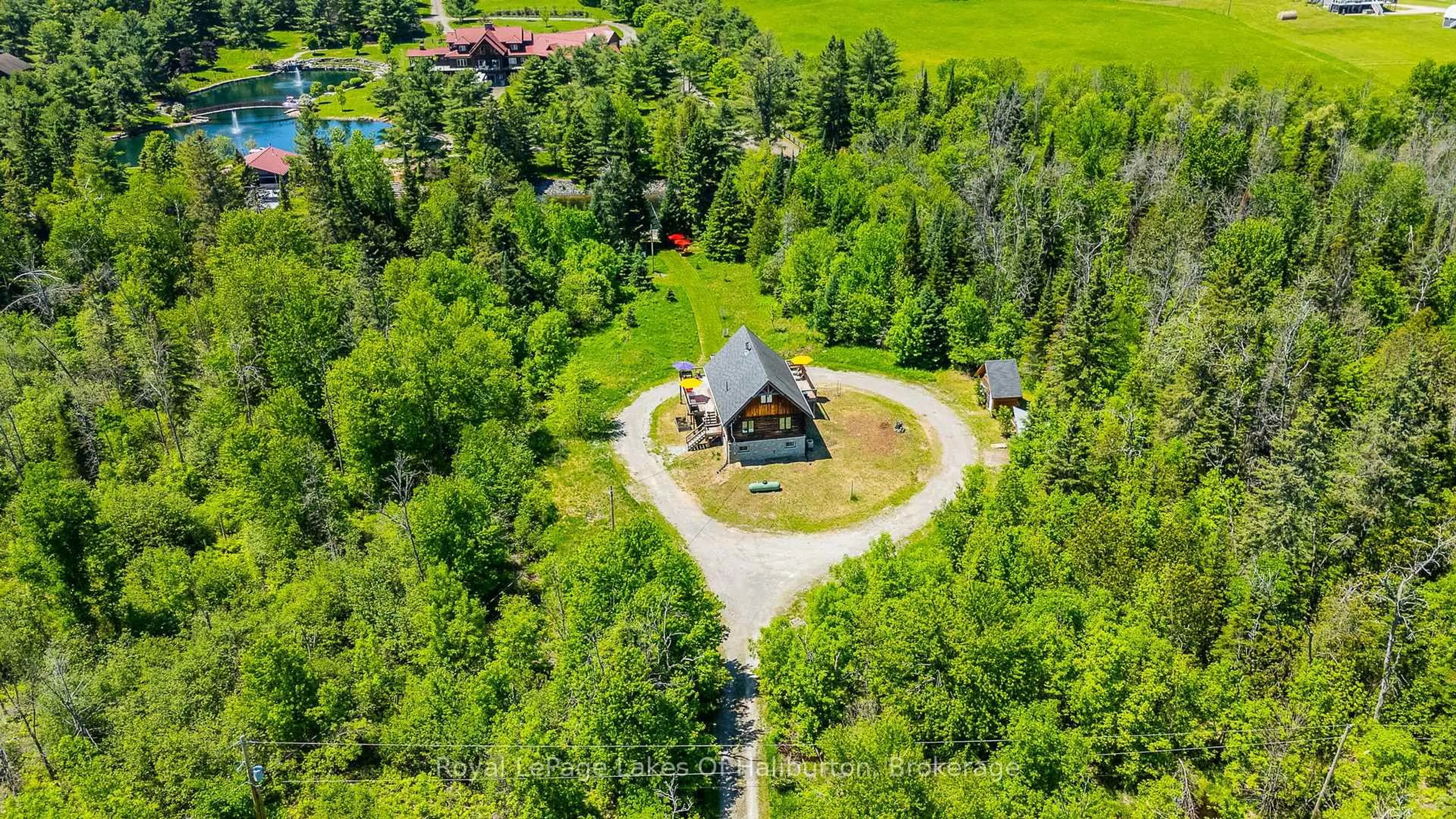 A pic from outside/outdoor area/front of a property/back of a property/a pic from drone, unknown for 1393 Hunter Creek Rd, Minden Hills Ontario K0M 2K0