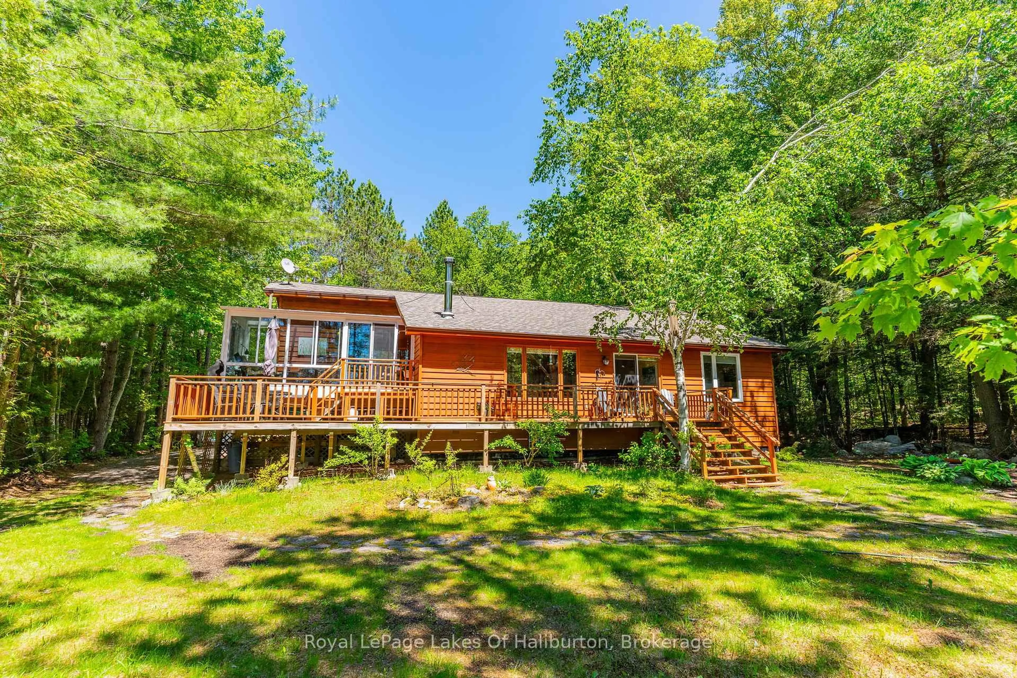 A pic from outside/outdoor area/front of a property/back of a property/a pic from drone, water/lake/river/ocean view for 1349 Trellis Tr, Minden Hills Ontario K0M 2K0