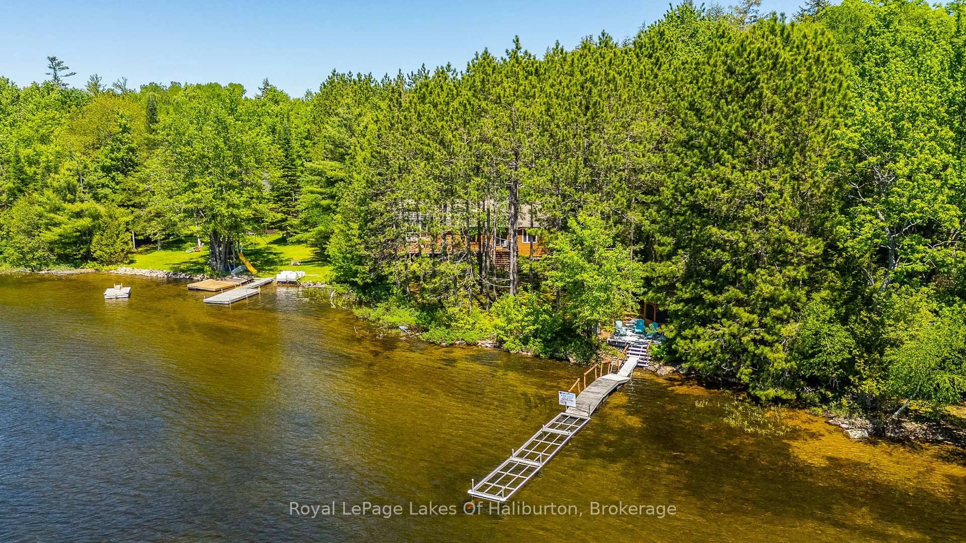 A pic from outside/outdoor area/front of a property/back of a property/a pic from drone, water/lake/river/ocean view for 1349 Trellis Tr, Minden Hills Ontario K0M 2K0