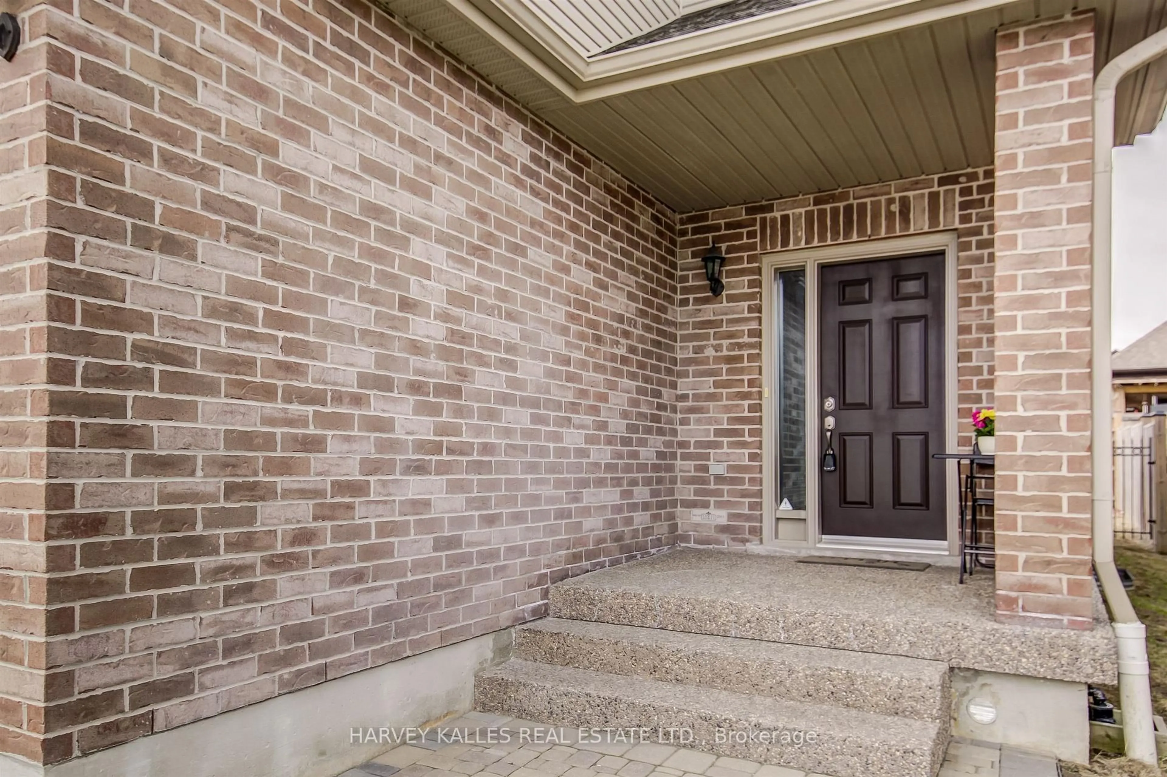 Home with brick exterior material, street for 106 Eden Oak Tr, Kitchener Ontario N2A 0G1
