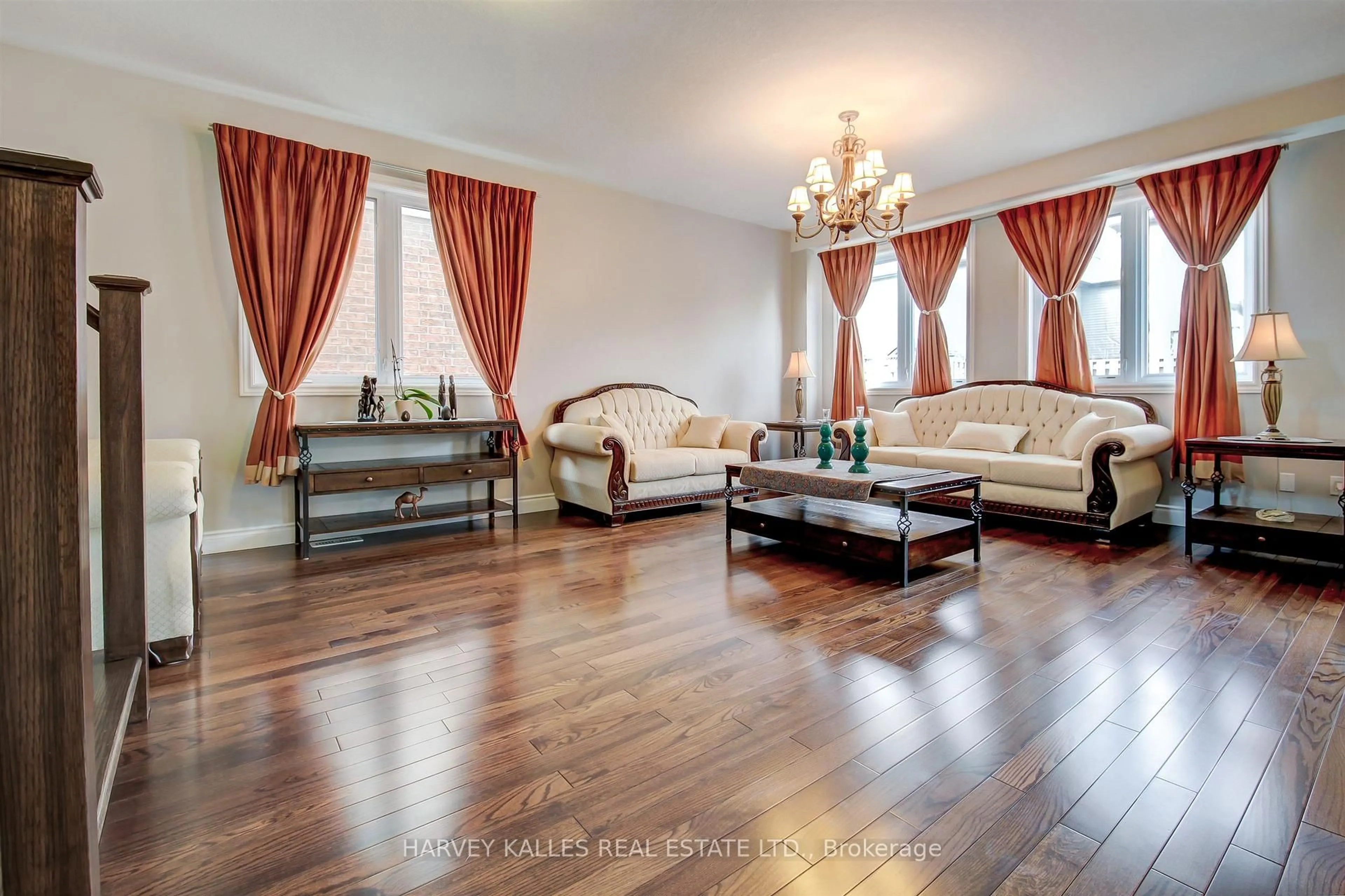 Living room with furniture, wood/laminate floor for 106 Eden Oak Tr, Kitchener Ontario N2A 0G1