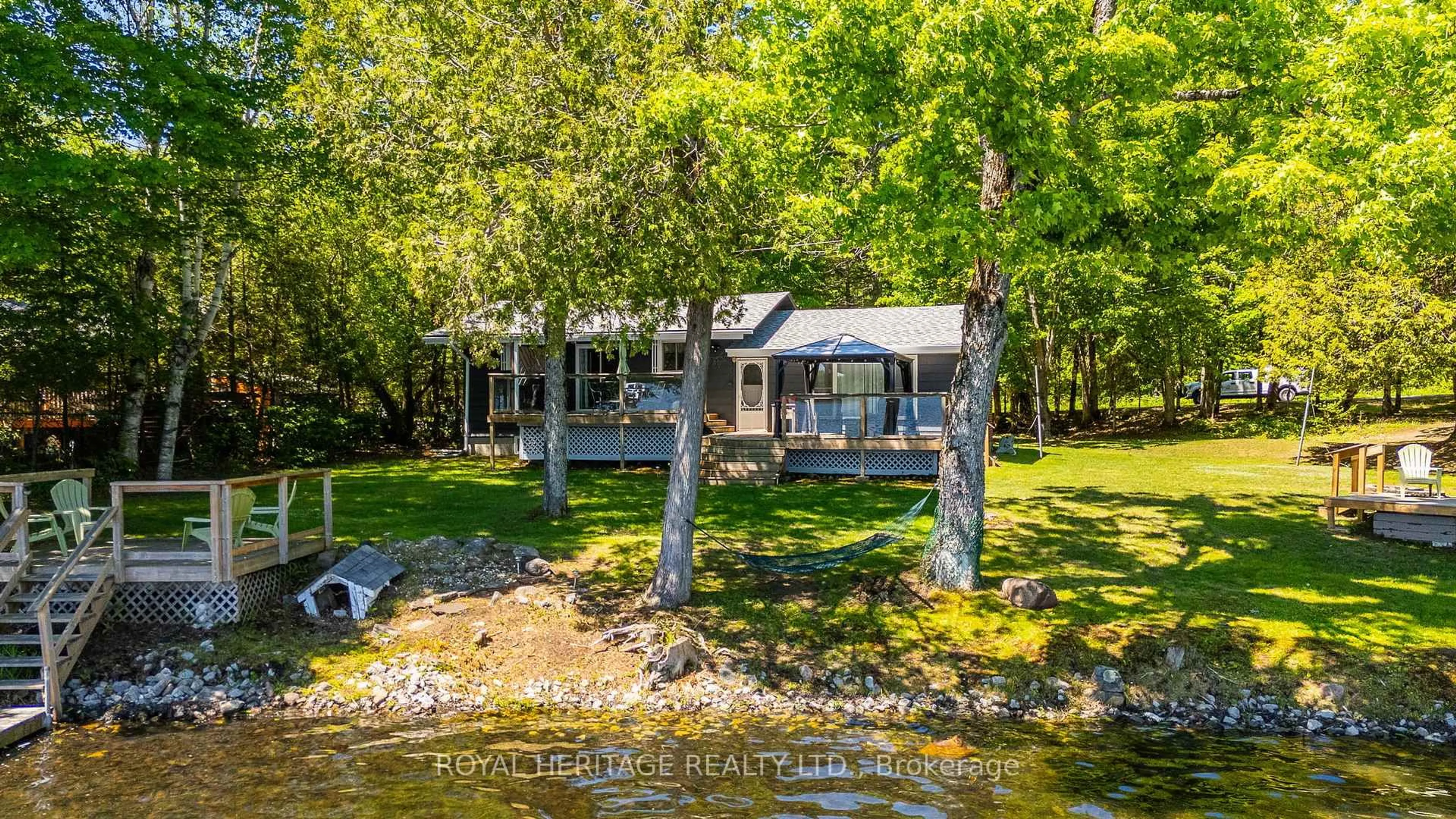 A pic from outside/outdoor area/front of a property/back of a property/a pic from drone, water/lake/river/ocean view for 1582 Hospitality Rd, Minden Hills Ontario K0M 2K0