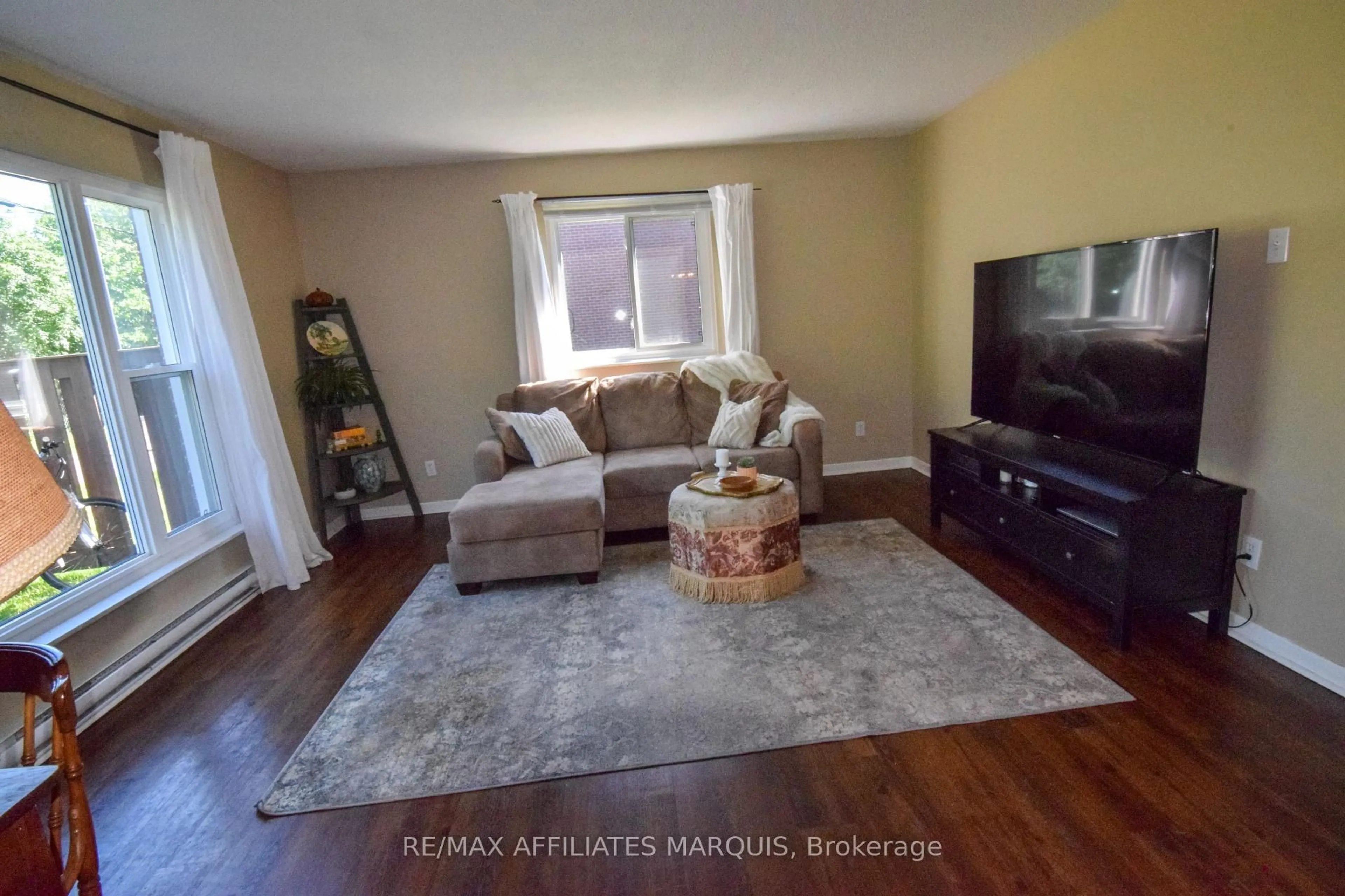 Living room with furniture, wood/laminate floor for 4 Pearl St #"R", Smiths Falls Ontario K7A 5B5