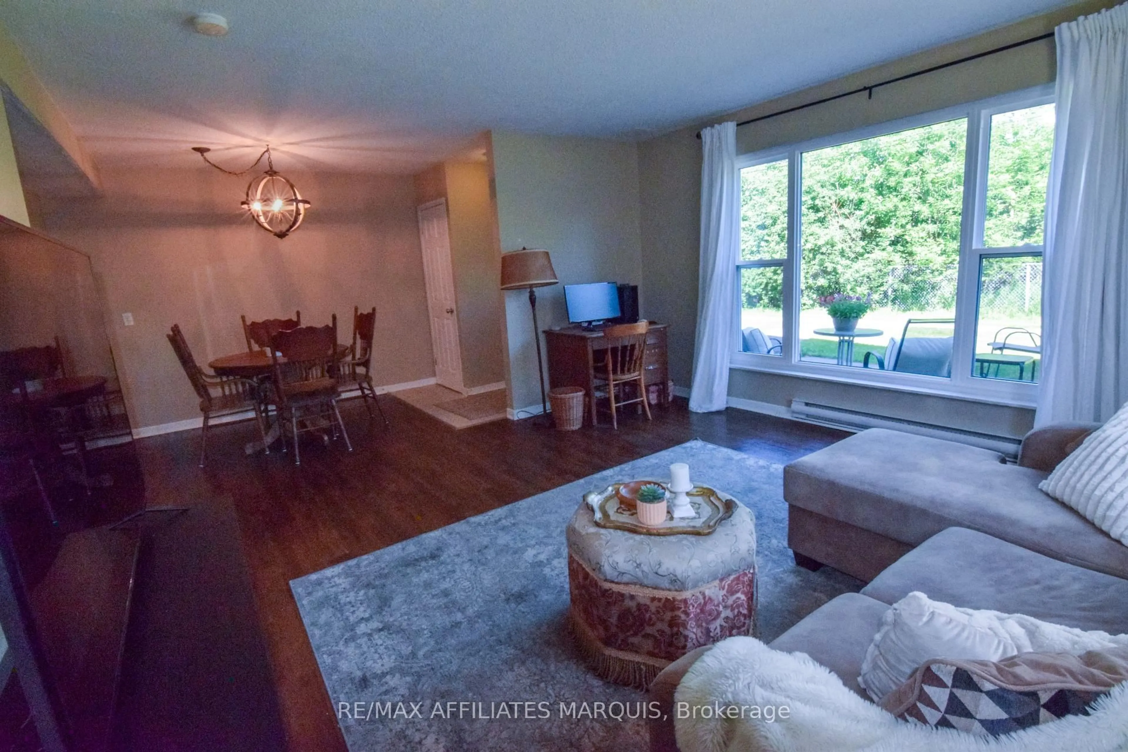 Living room with furniture, wood/laminate floor for 4 Pearl St #"R", Smiths Falls Ontario K7A 5B5