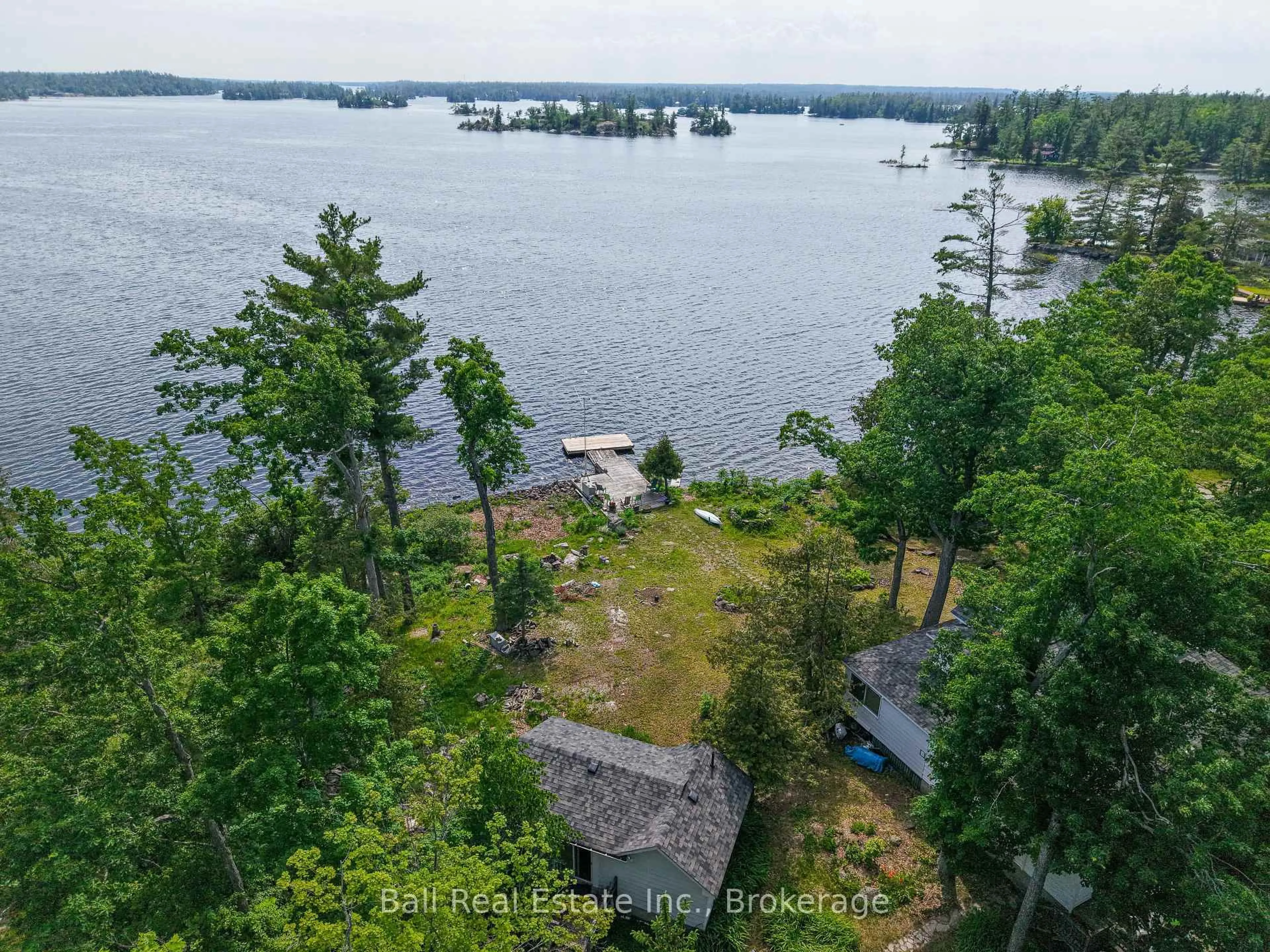 A pic from outside/outdoor area/front of a property/back of a property/a pic from drone, water/lake/river/ocean view for 86 Fire Route 7, North Kawartha Ontario K0L 3E0