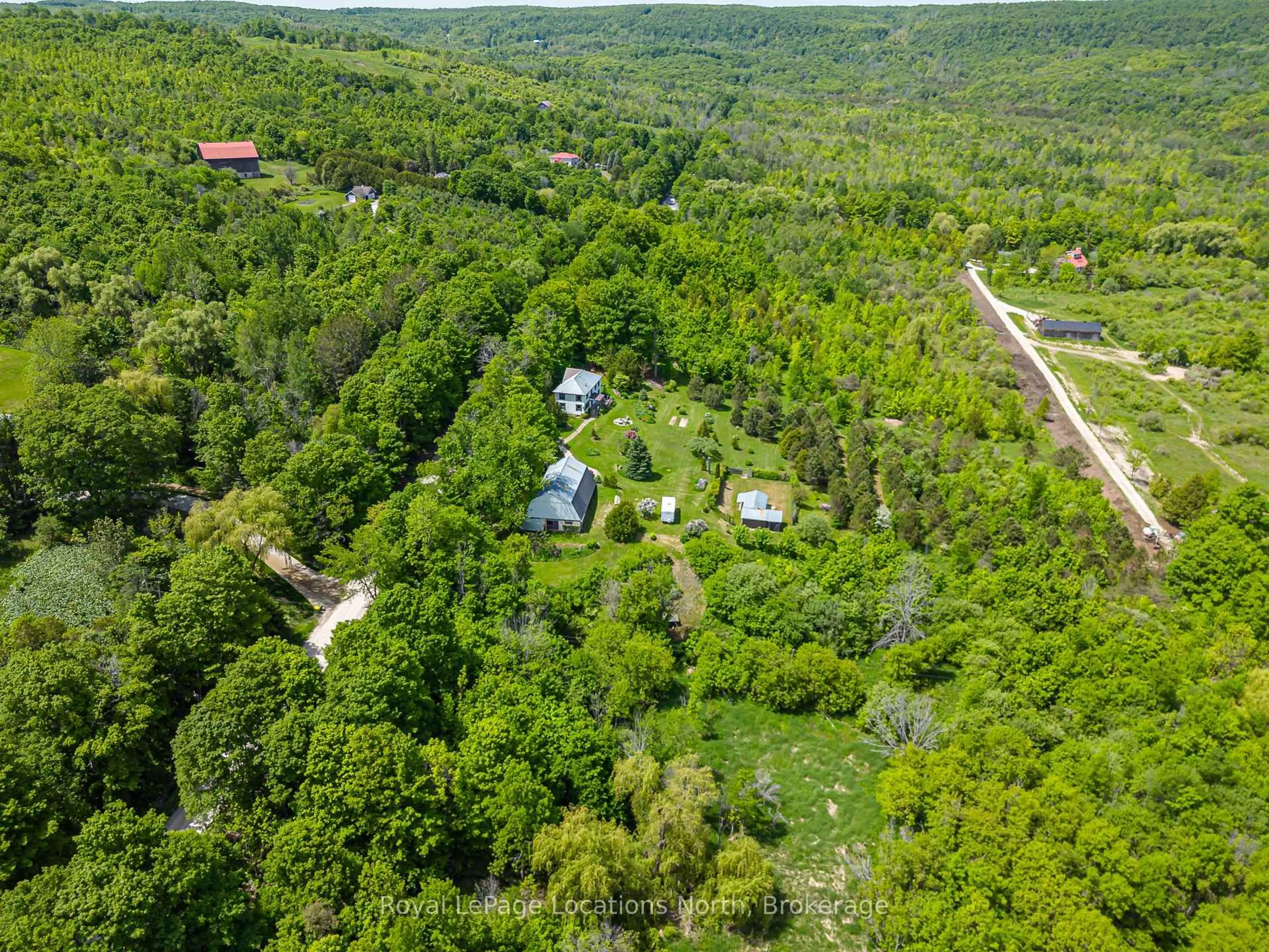 A pic from outside/outdoor area/front of a property/back of a property/a pic from drone, forest/trees view for 529685 Osprey - The Blue Mountains Townline, Blue Mountains Ontario N0H 2P0
