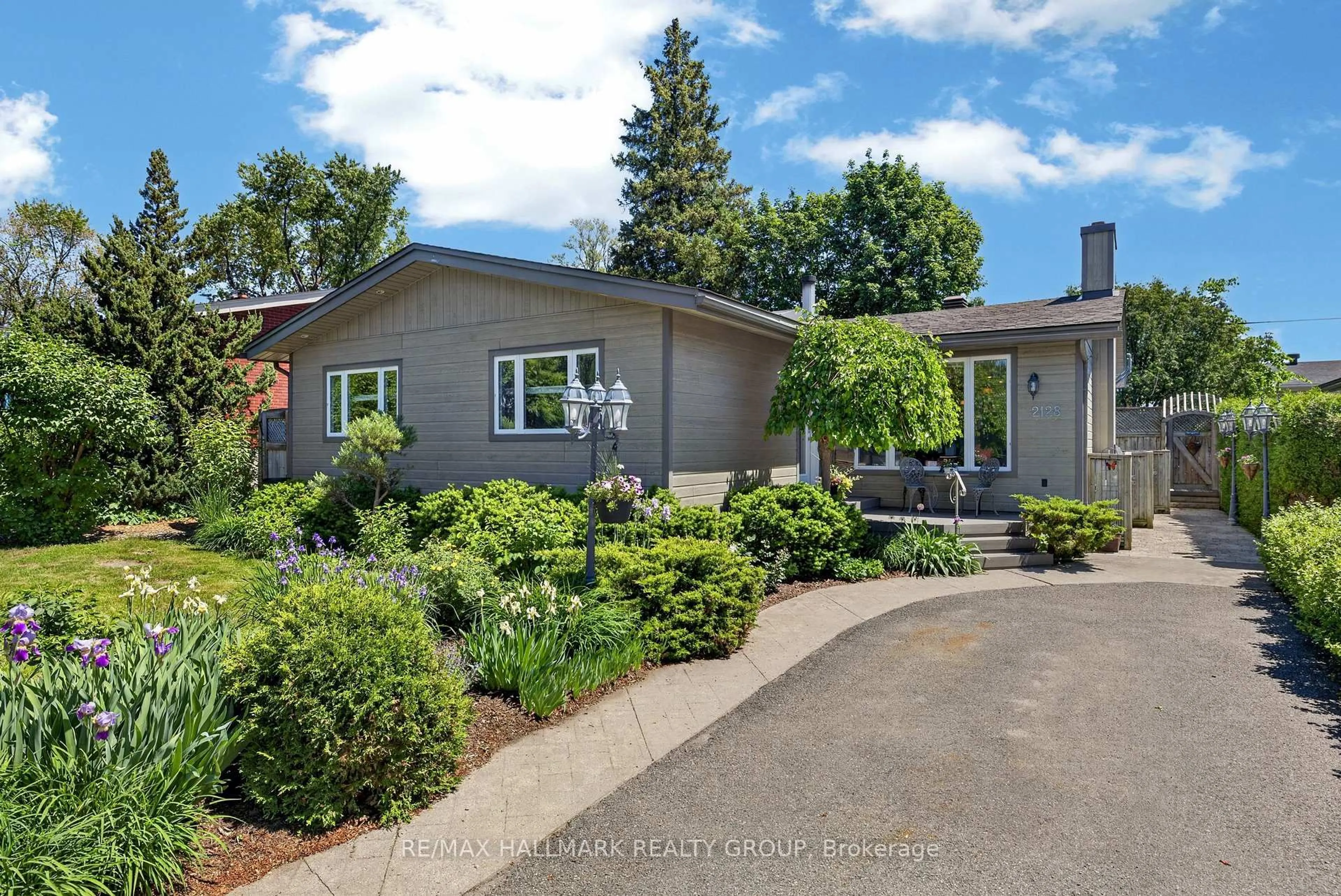 Home with vinyl exterior material, street for 2128 Benjamin Ave, Ottawa Ontario K2A 1P4