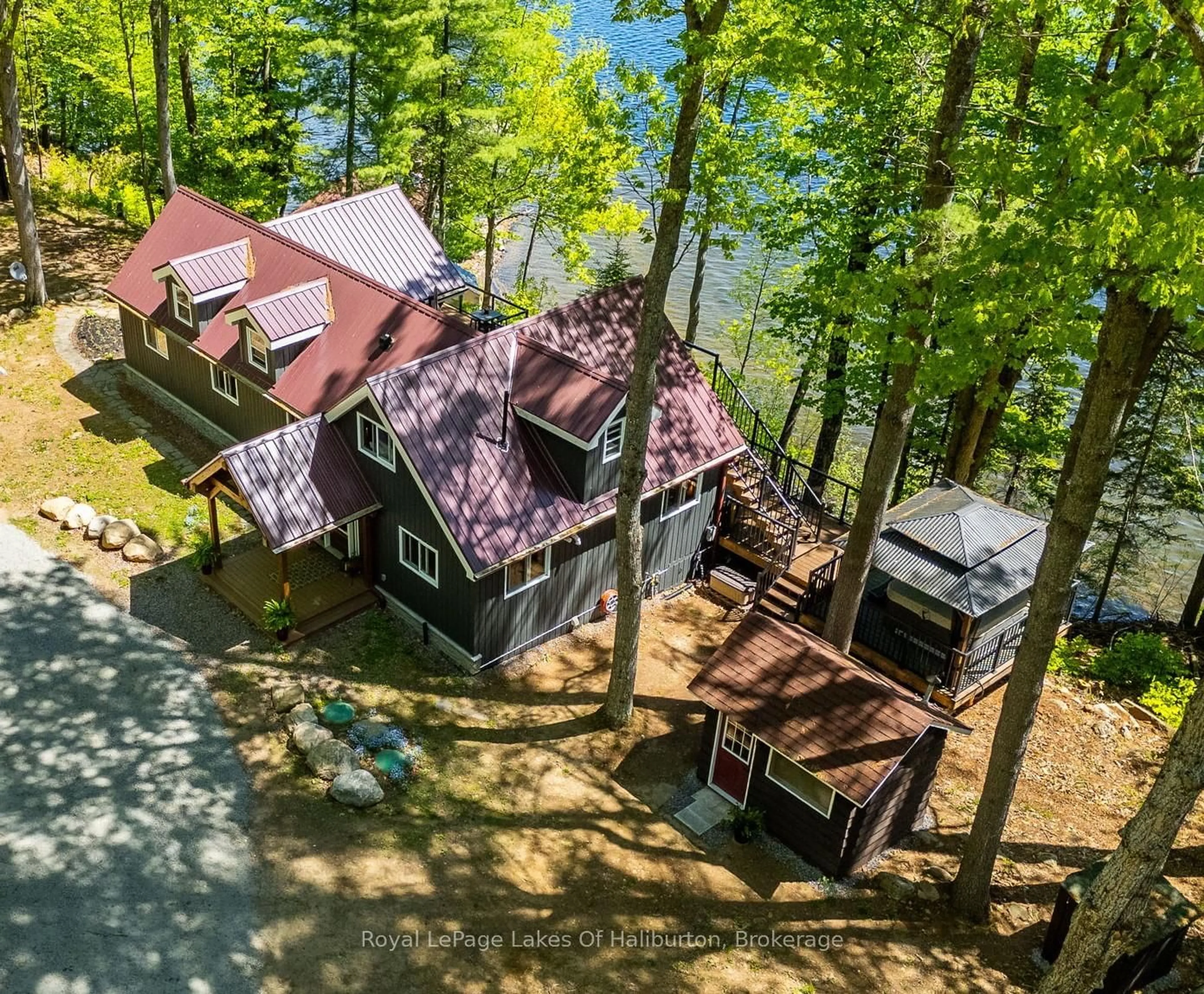 A pic from outside/outdoor area/front of a property/back of a property/a pic from drone, water/lake/river/ocean view for 1272 Boshkung Lake Rd, Algonquin Highlands Ontario K0M 1S0