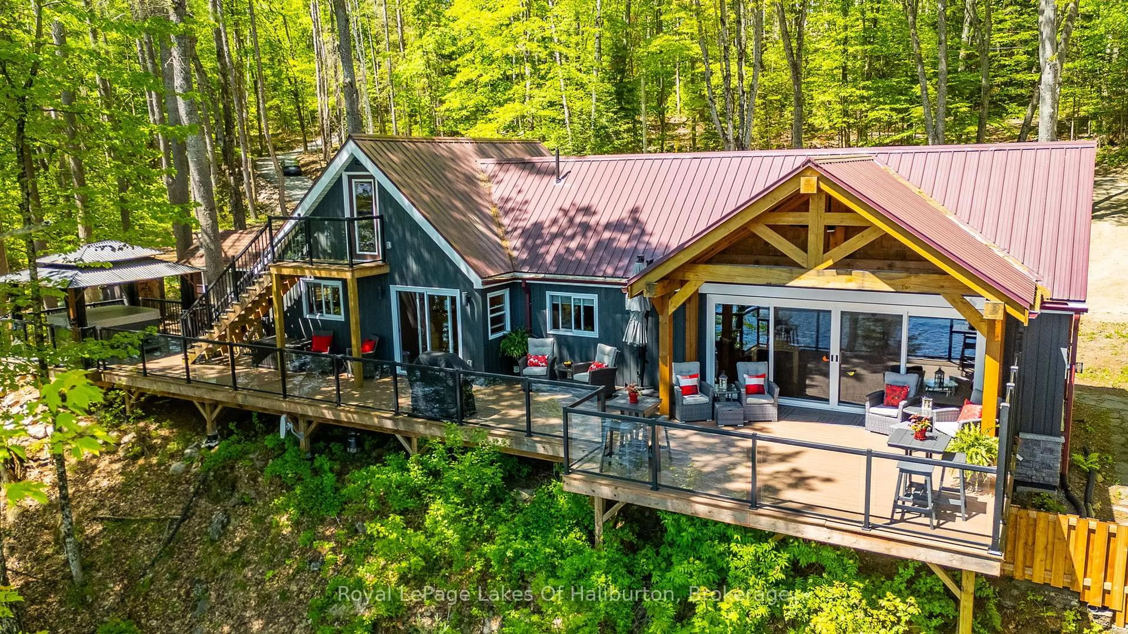 A pic from outside/outdoor area/front of a property/back of a property/a pic from drone, water/lake/river/ocean view for 1272 Boshkung Lake Rd, Algonquin Highlands Ontario K0M 1S0