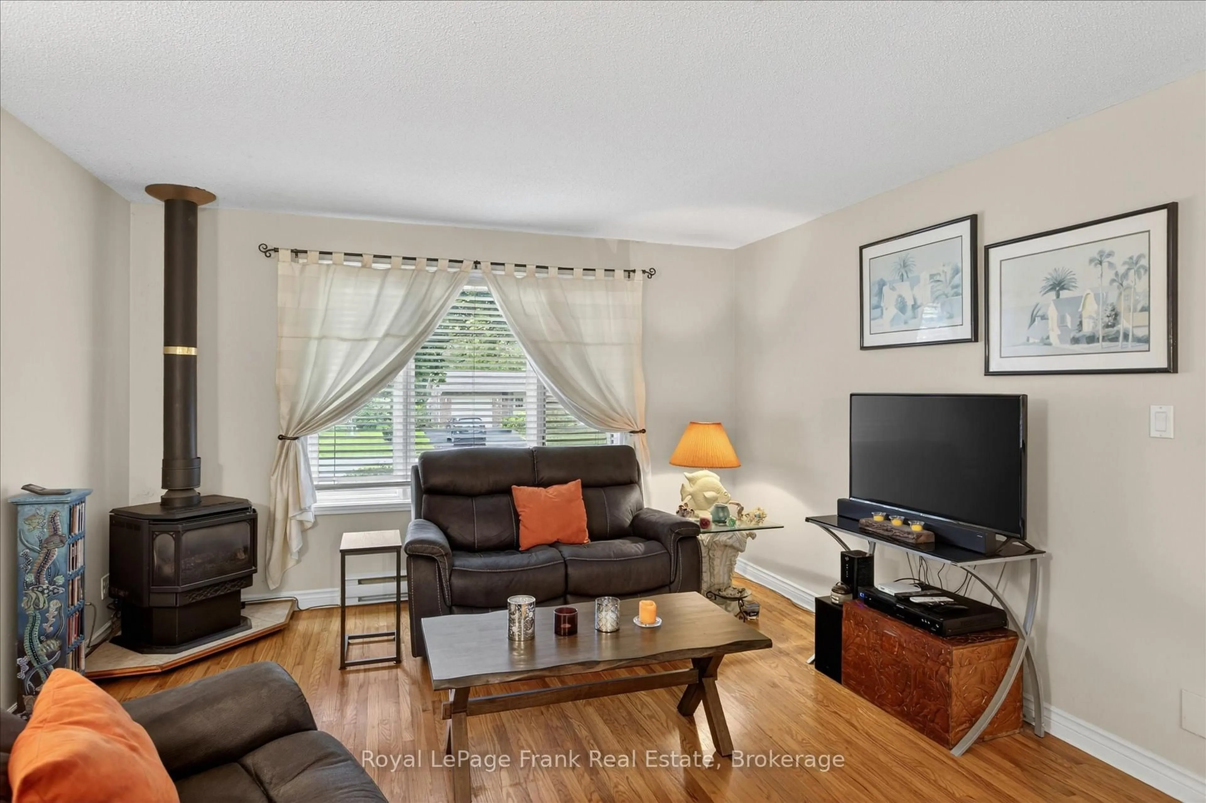 Living room with furniture, wood/laminate floor for 11 Morrow Ave, Brighton Ontario K0K 1H0