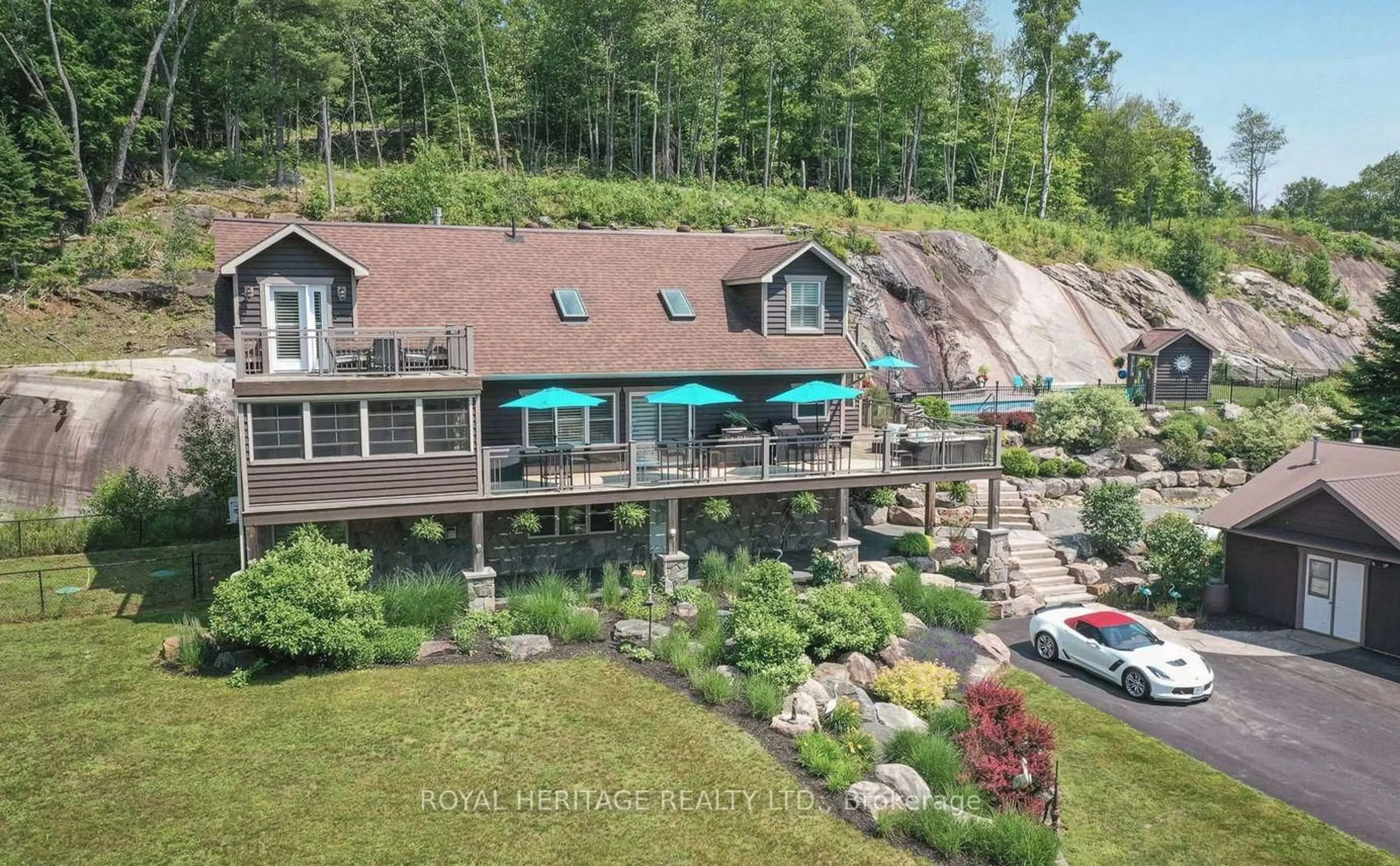 A pic from outside/outdoor area/front of a property/back of a property/a pic from drone, water/lake/river/ocean view for 120 Hutcheson Beach Rd, Huntsville Ontario P1H 1N4