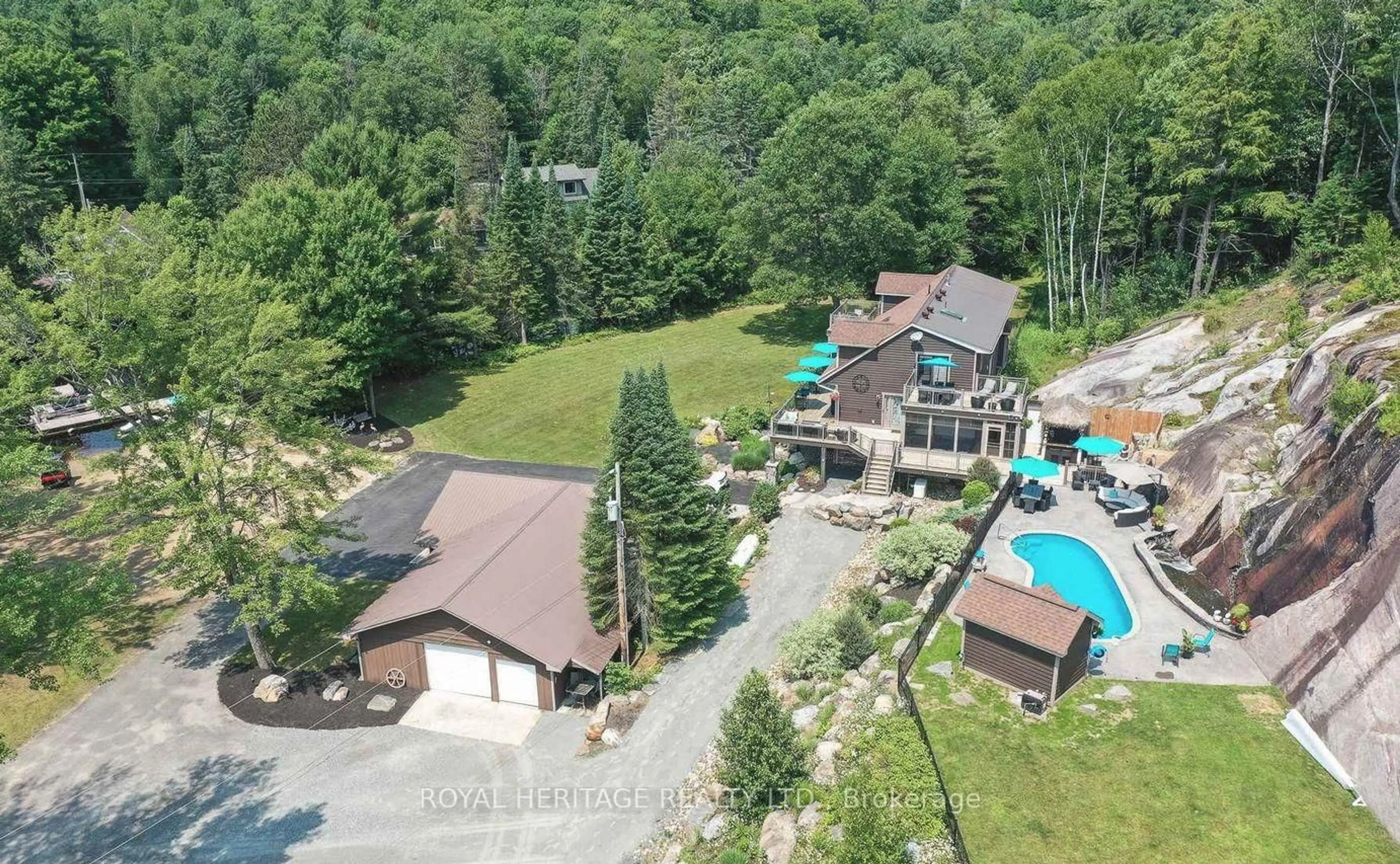 A pic from outside/outdoor area/front of a property/back of a property/a pic from drone, mountain view for 120 Hutcheson Beach Rd, Huntsville Ontario P1H 1N4