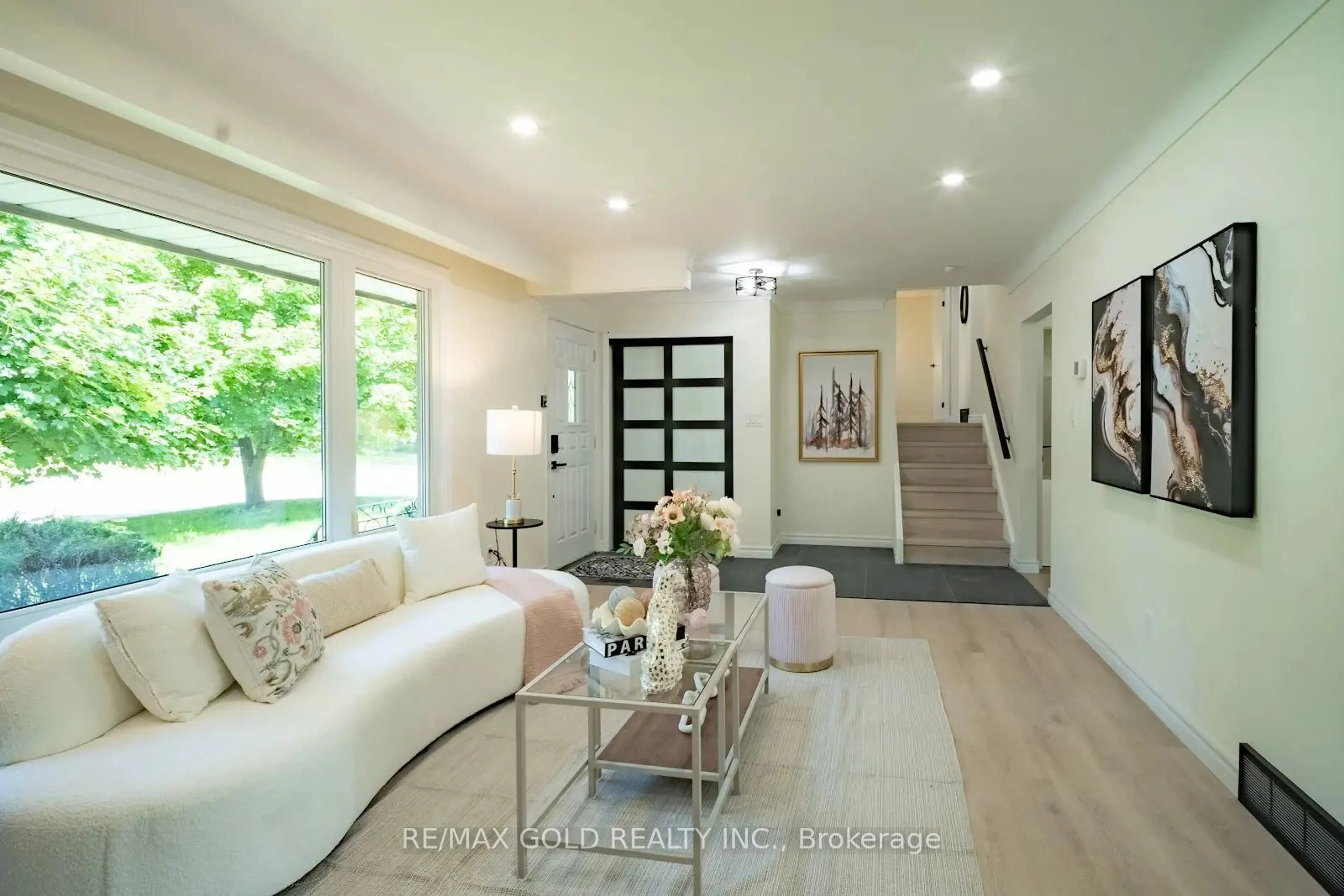 Living room with furniture, wood/laminate floor for 4682 Pinedale Dr, Niagara Falls Ontario L2E 6M8