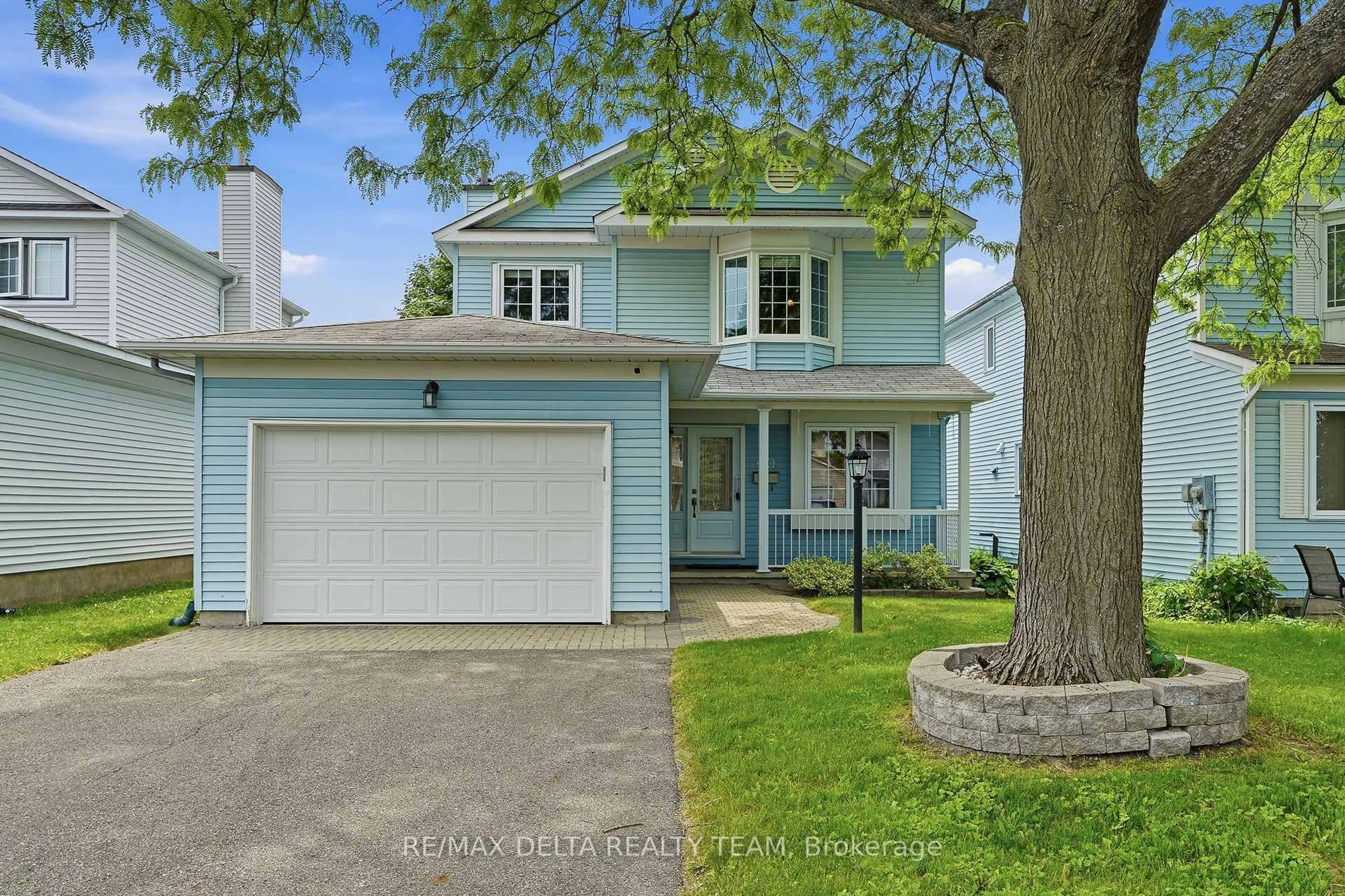 Home with vinyl exterior material, street for 310 Mceachern Cres, Orleans Ontario K1E 3K2