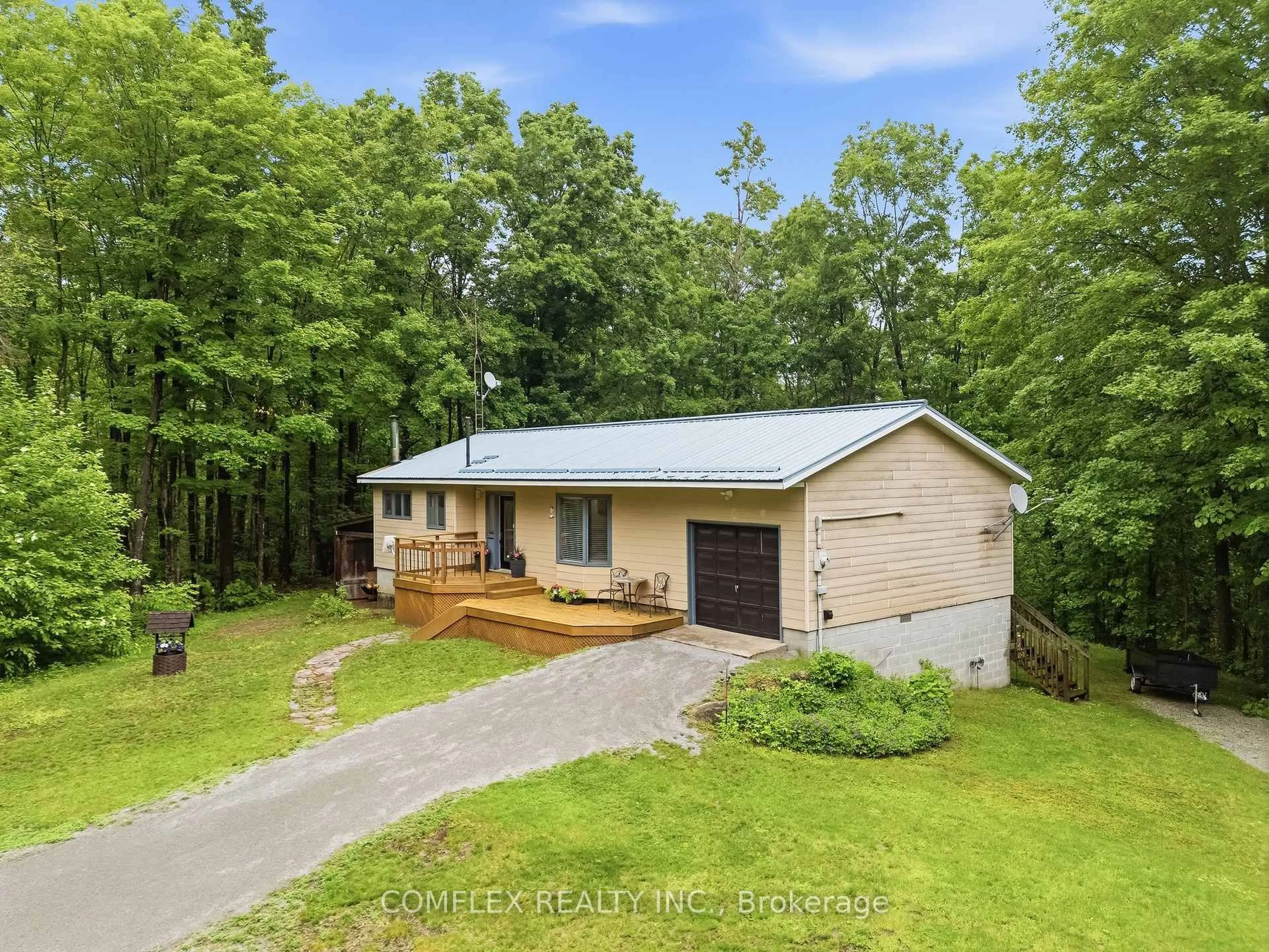 A pic from outside/outdoor area/front of a property/back of a property/a pic from drone, forest/trees view for 1354 Clear Lake Rd, Minden Hills Ontario K0M 2L1