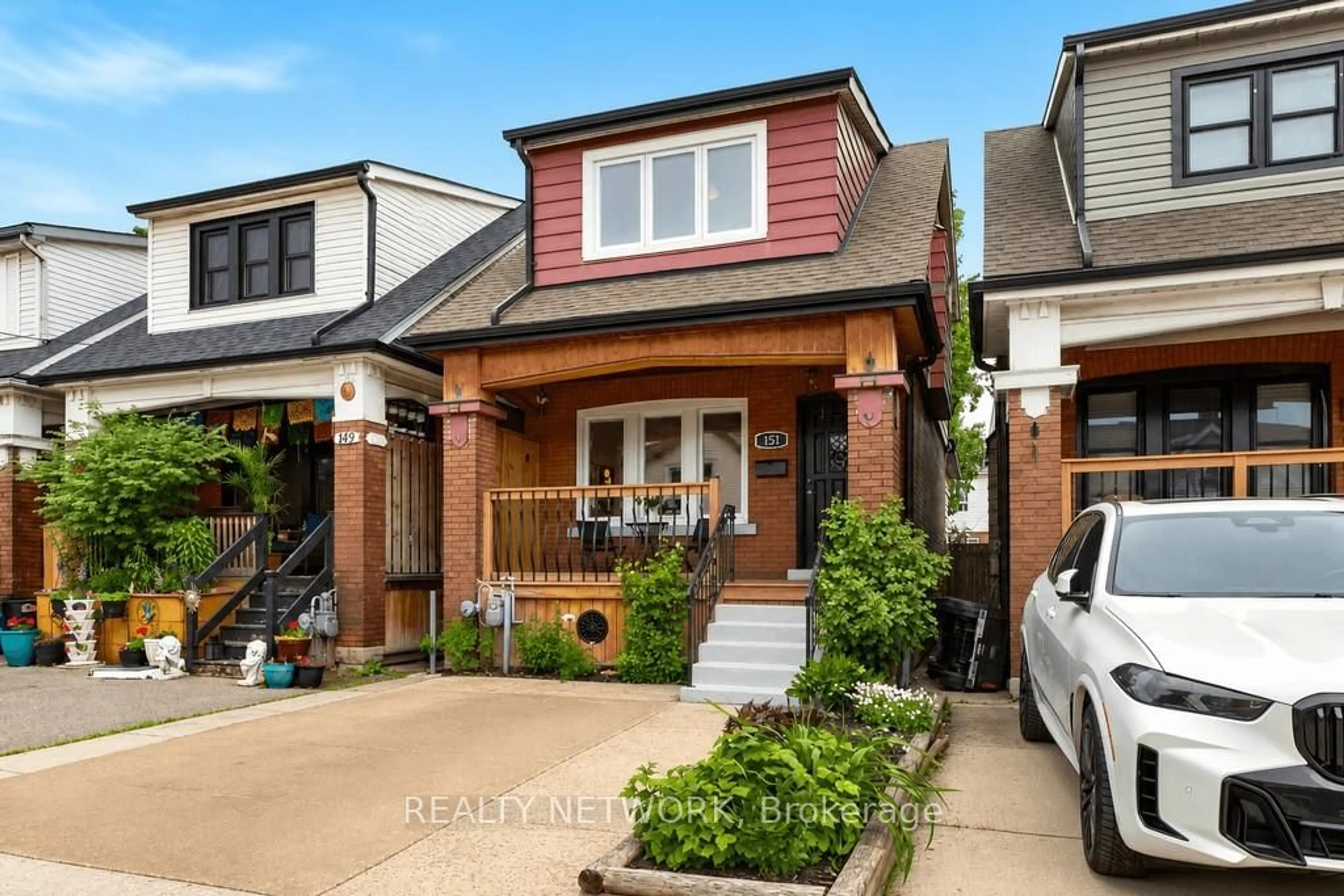 Home with brick exterior material, street for 151 Connaught Ave, Hamilton Ontario L8L 6Z4