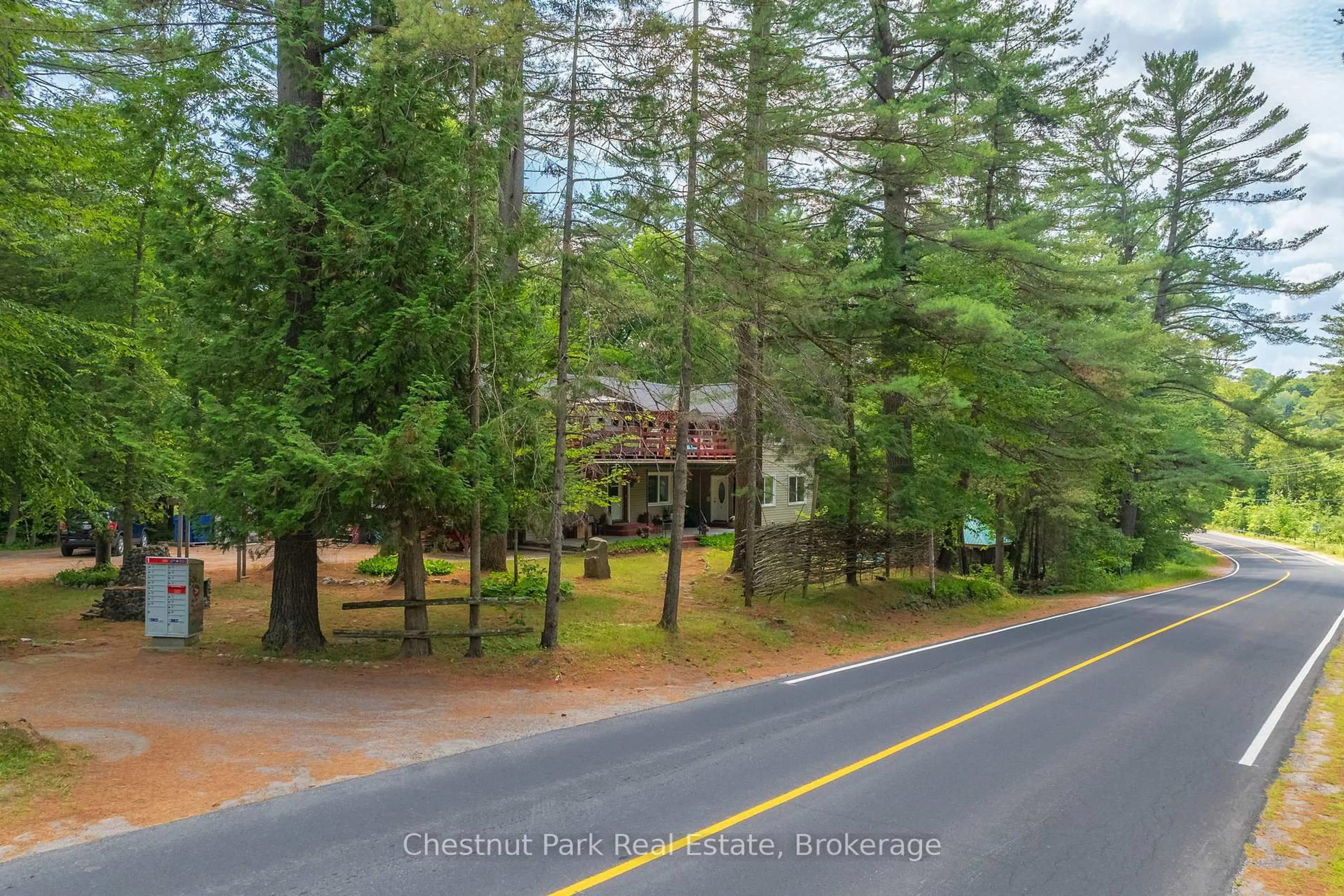 A pic from outside/outdoor area/front of a property/back of a property/a pic from drone, forest/trees view for 869 Muskoka Road 10, Huntsville Ontario P0B 1L0