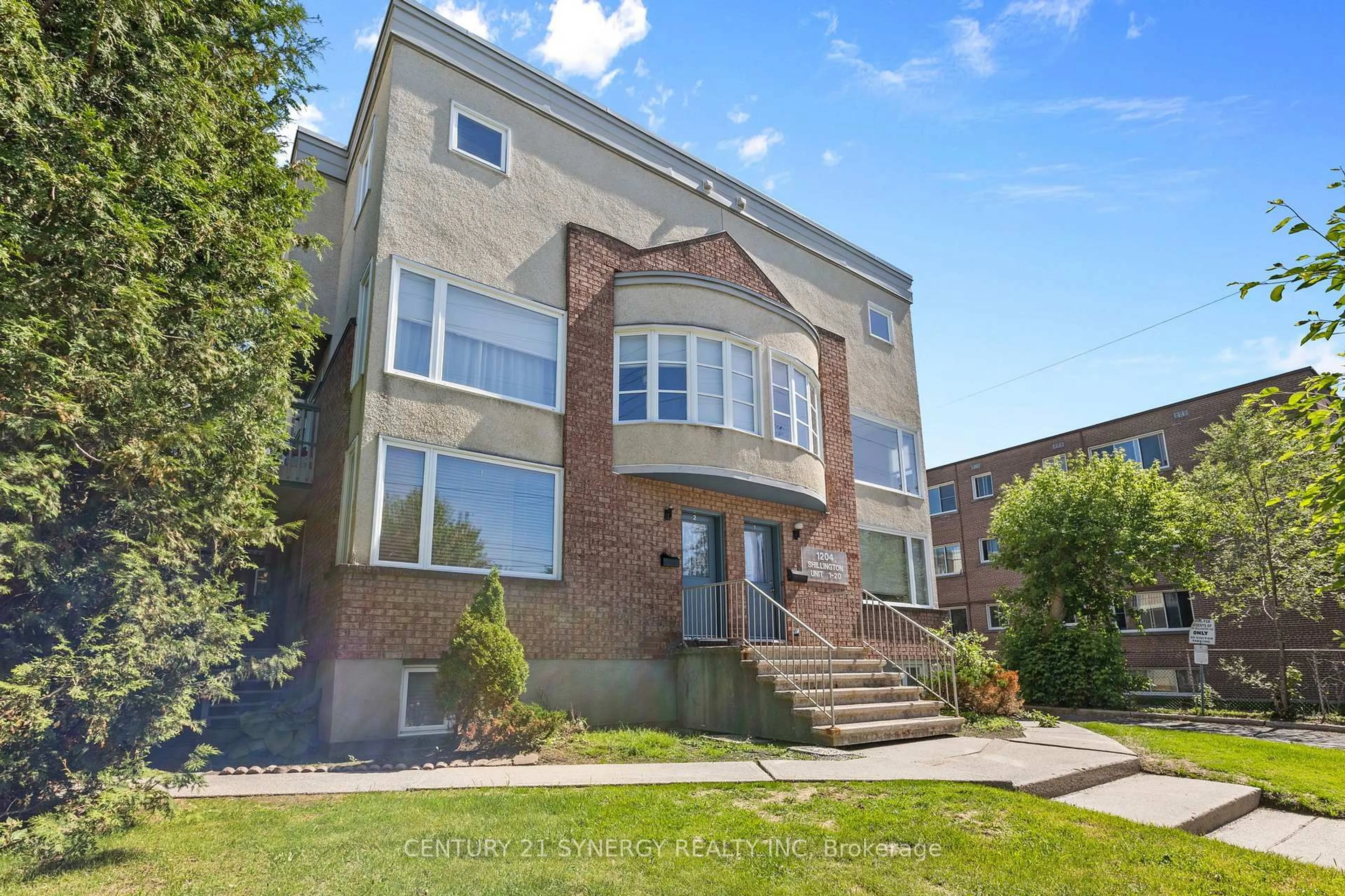 Home with brick exterior material, street for 1204 Shillington Ave #8, Ottawa Ontario K1Z 7Z4