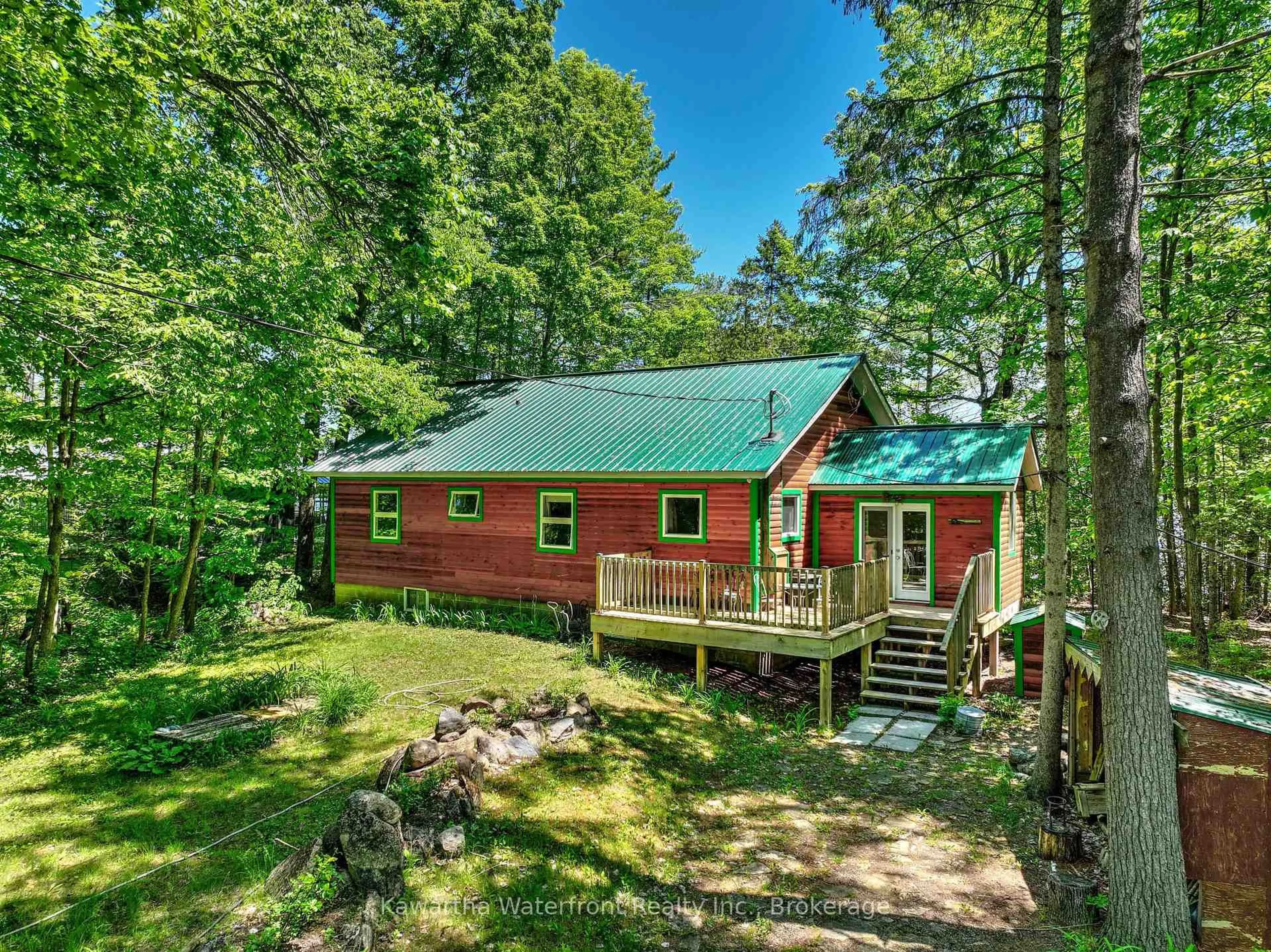 A pic from outside/outdoor area/front of a property/back of a property/a pic from drone, forest/trees view for 14 Baker Blvd, Kawartha Lakes Ontario K0M 2B0