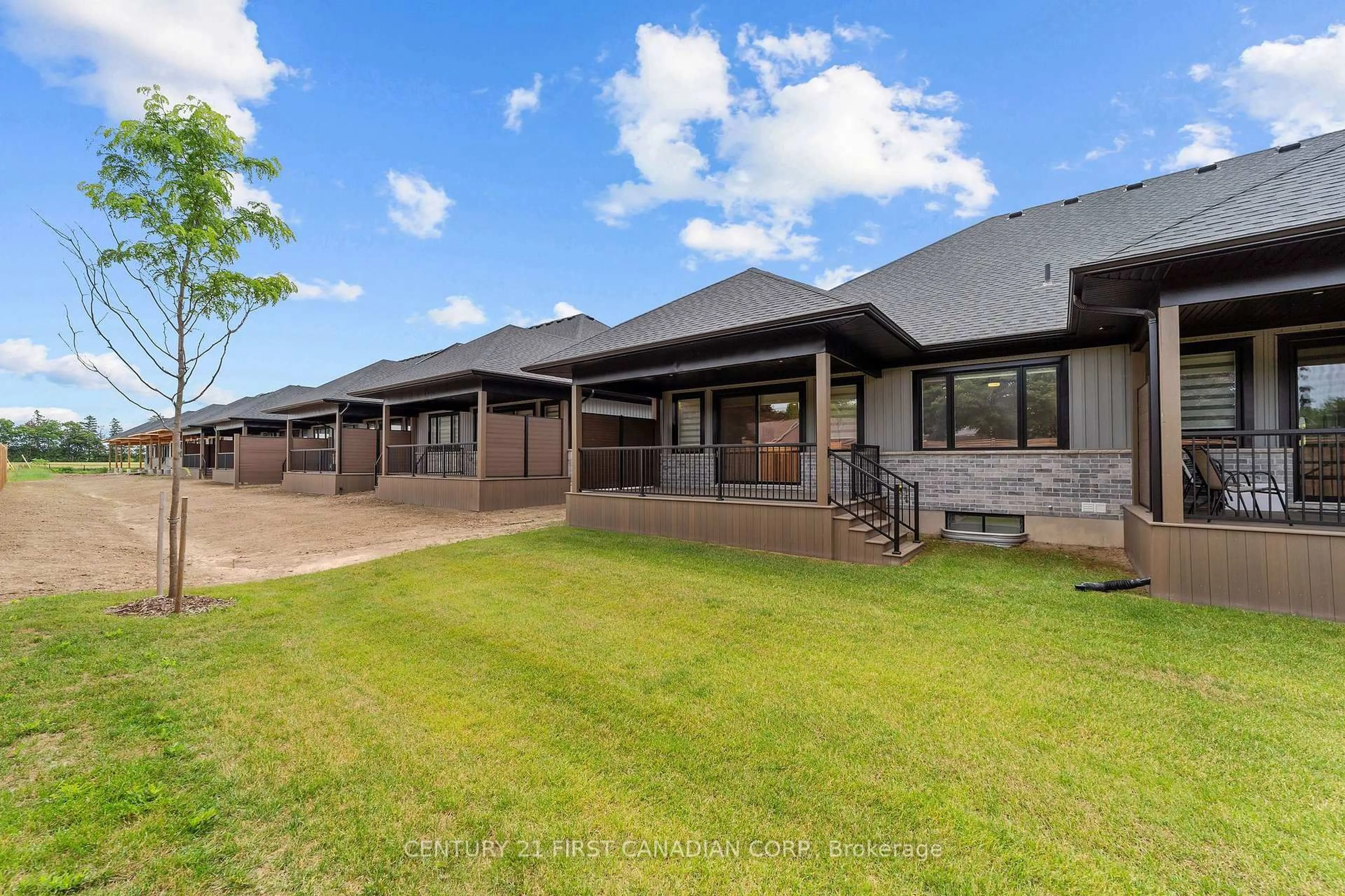 A pic from outside/outdoor area/front of a property/back of a property/a pic from drone, unknown for 32 Postma Cres #11, North Middlesex Ontario N0M 1A0